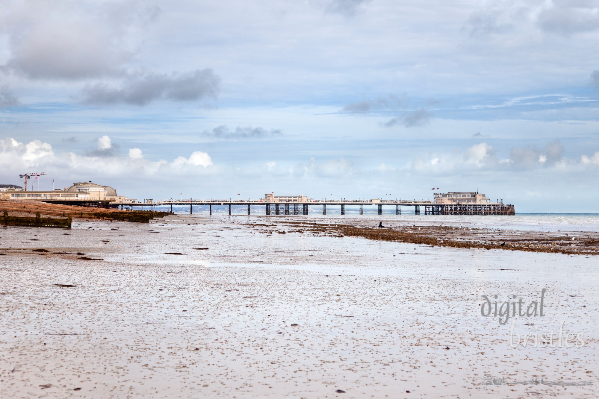 Sands at low tide by Worthing's Victorian pier