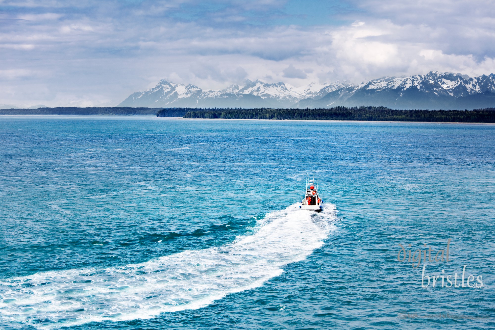 Boat turning away toward the mountains and wilderness, Glacier Bay National Park, Alaska