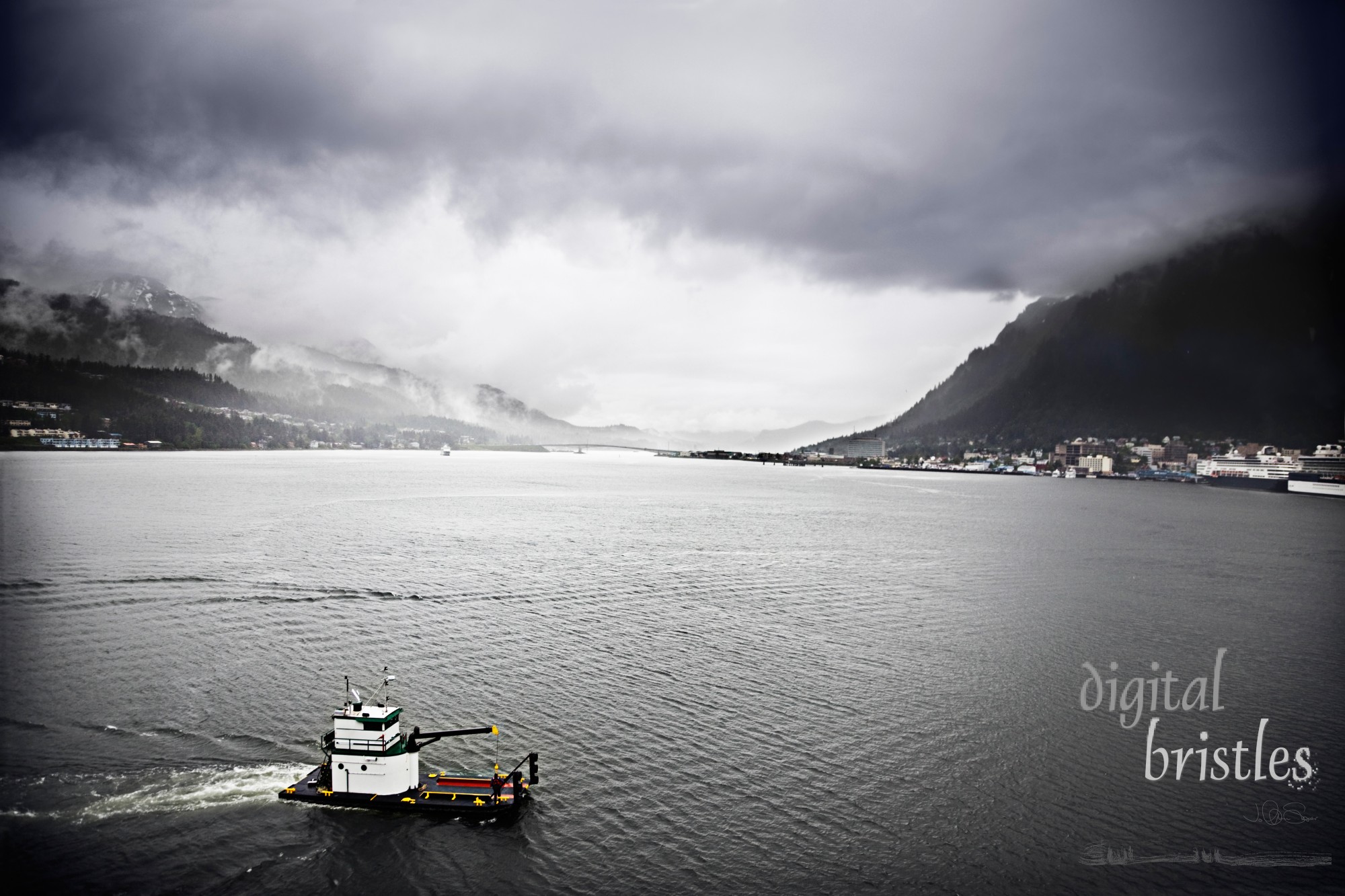 Ferry crosses the bay on a rainy day in Juneau, Alaska