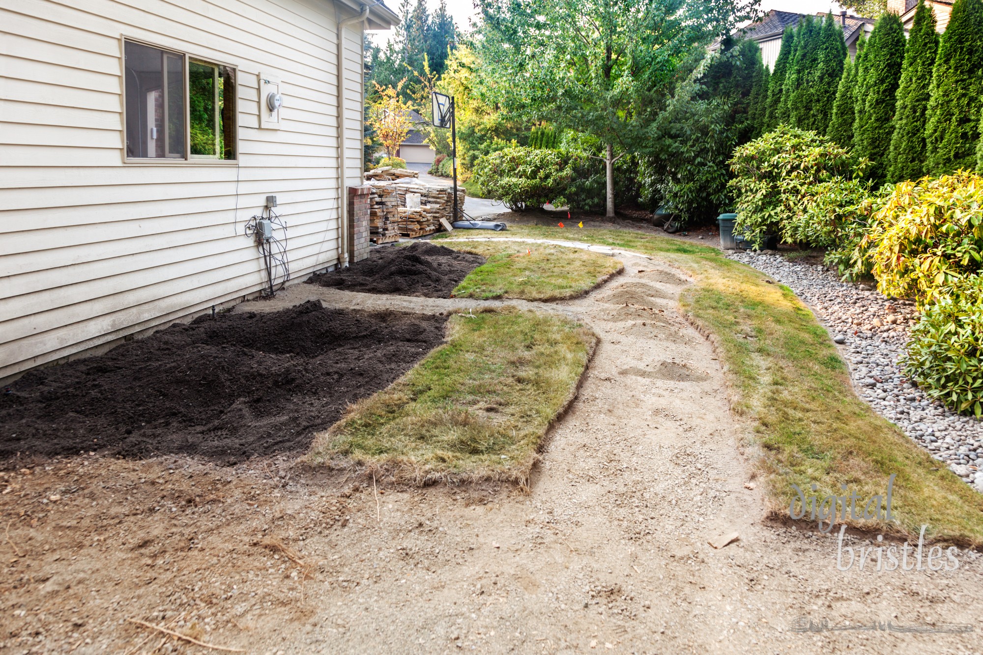 After removing concrete path and existing plants, cutting out the new path and patio areas