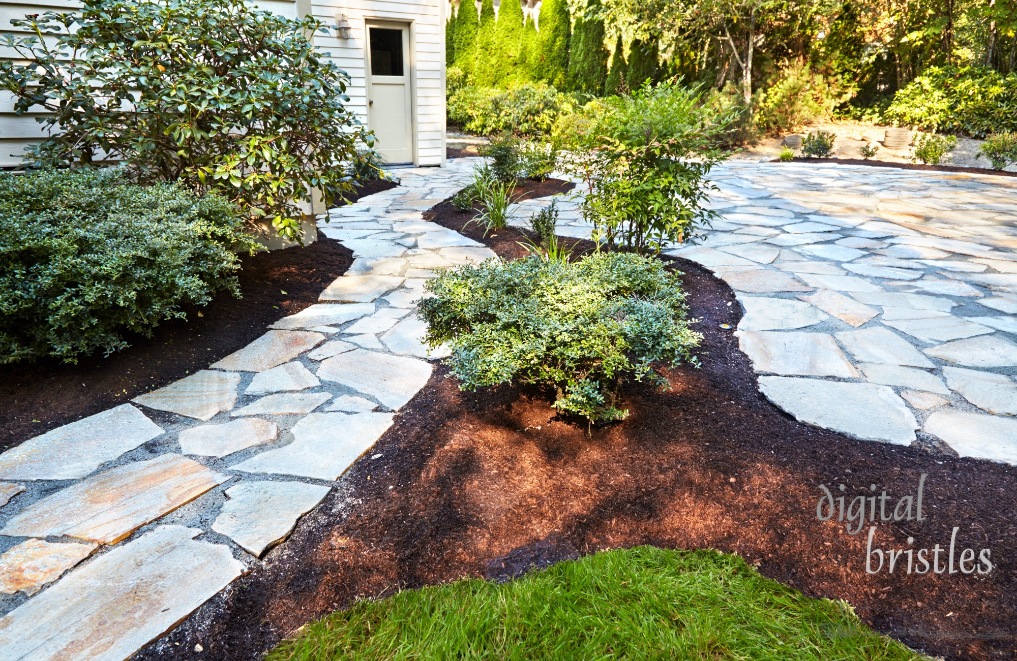 Stone patio and path to the back door complete