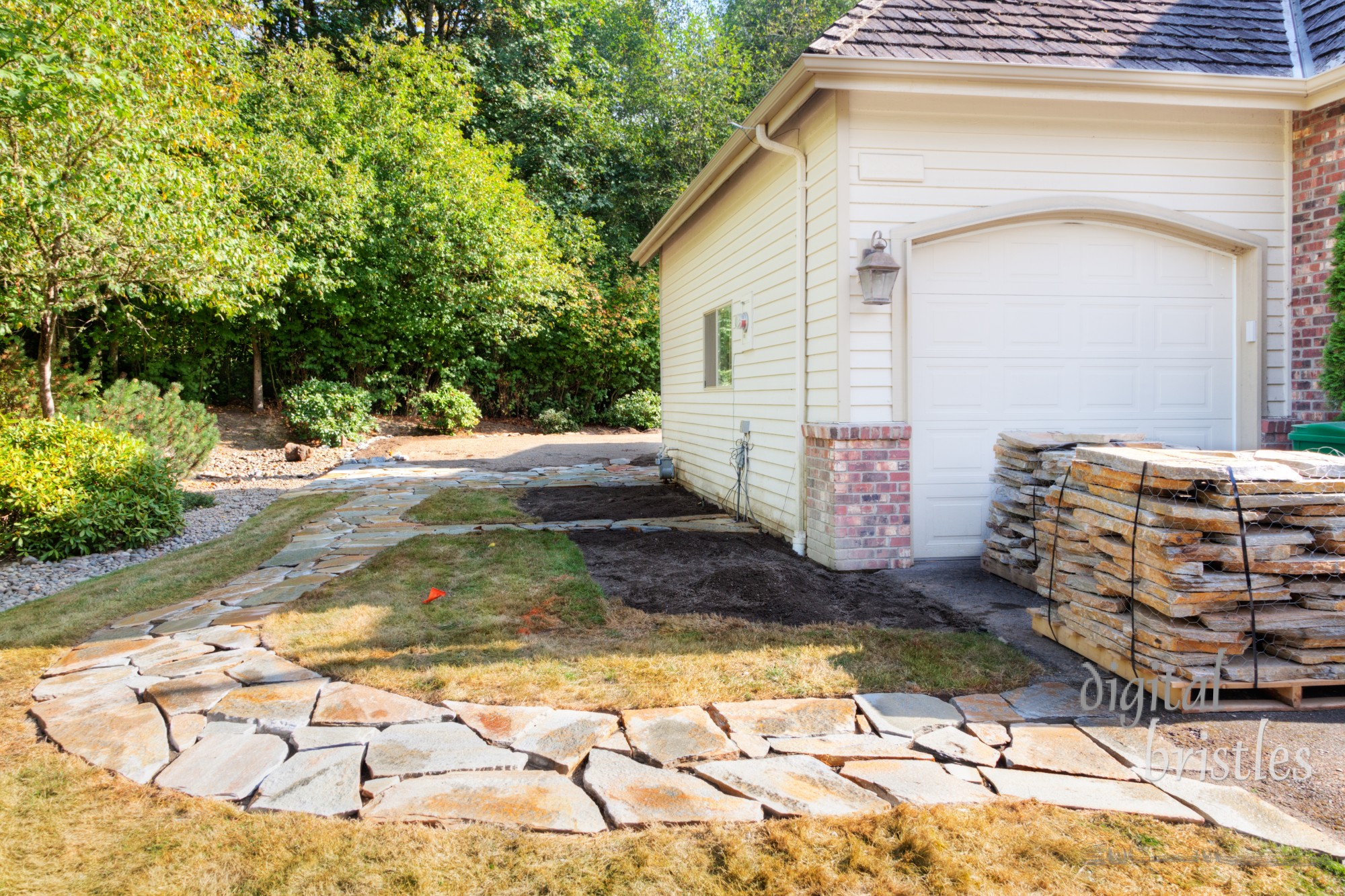 Stones laid into path cutout to patio edge