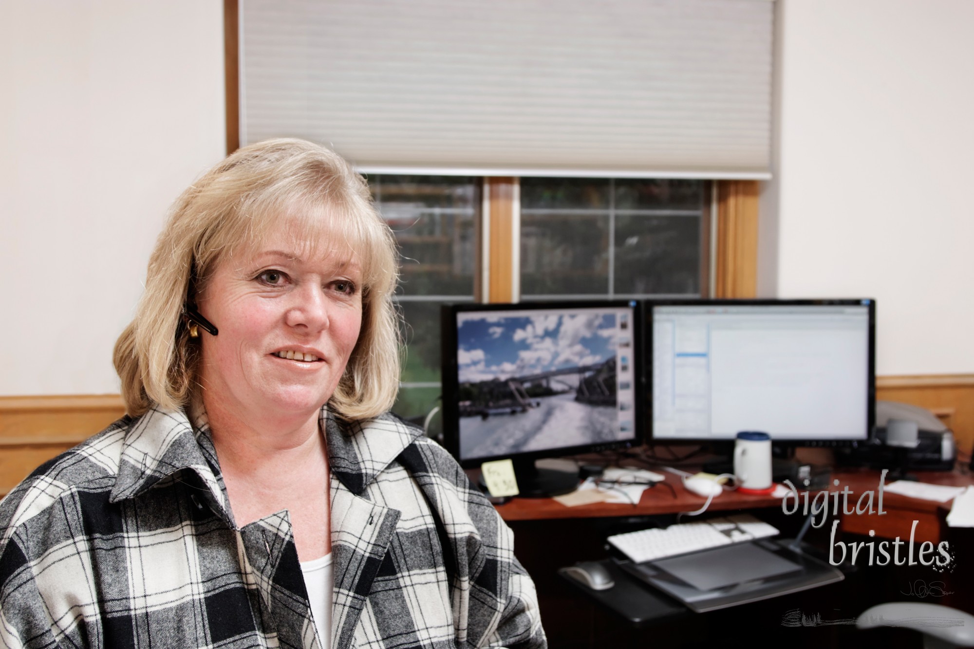 Mature woman on the phone in a home office