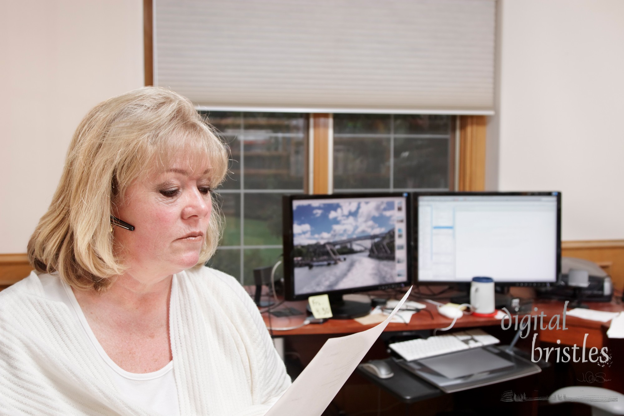 Mature woman on the phone in a home office