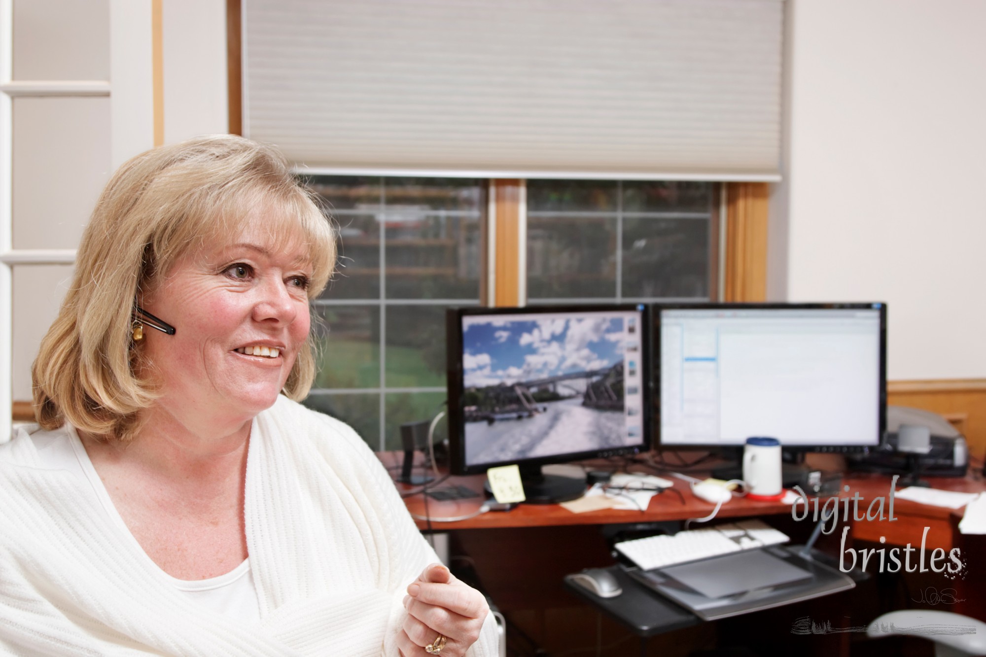 Mature woman on the phone in a home office