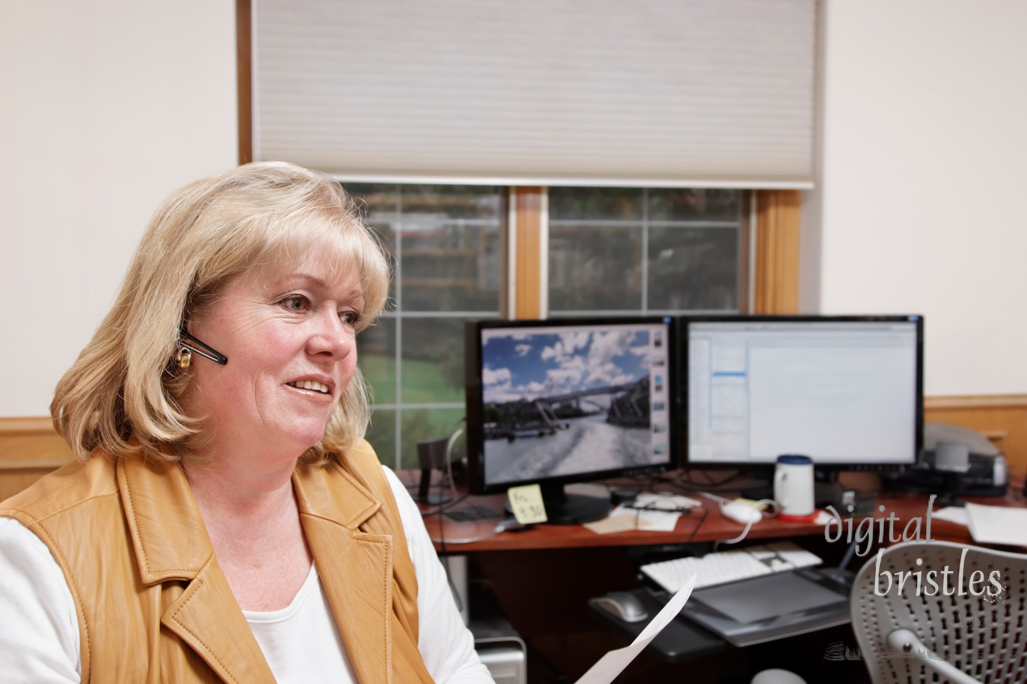 Mature woman on the phone in a home office