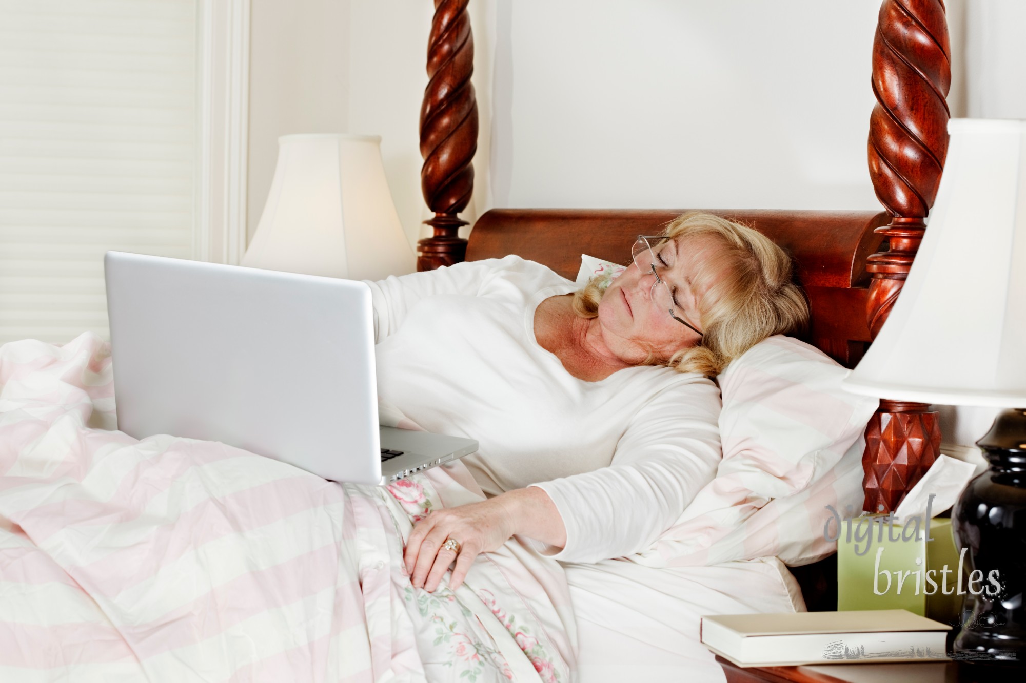 Mature woman falls asleep while trying to do a few more e-mails before bedtime