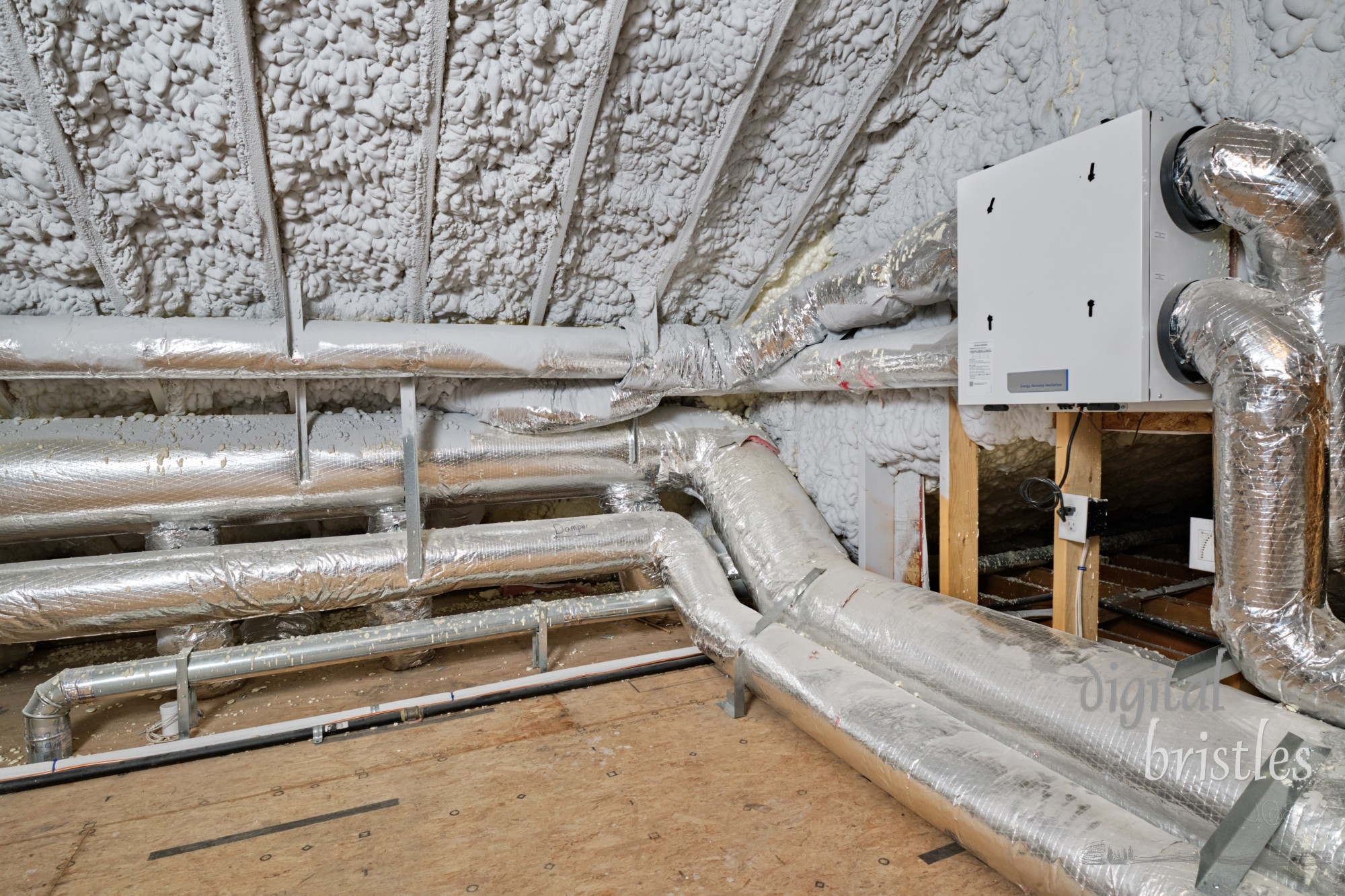 High efficiency energy recovery ventilator and heating/cooling system in insulated home attic