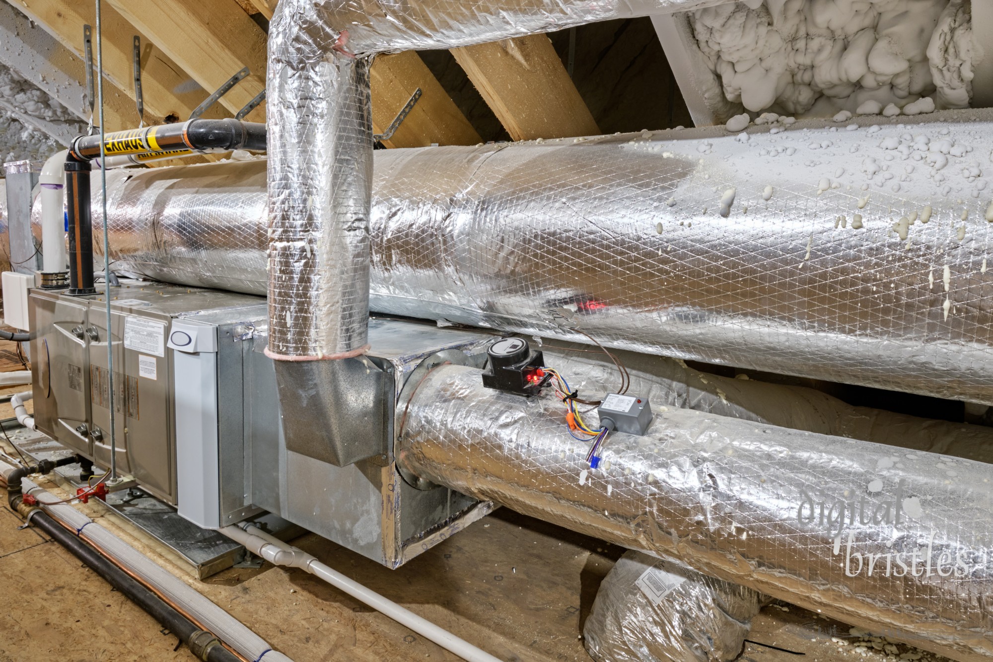 Furnace, air conditioning and duct work in a home's insulated attic