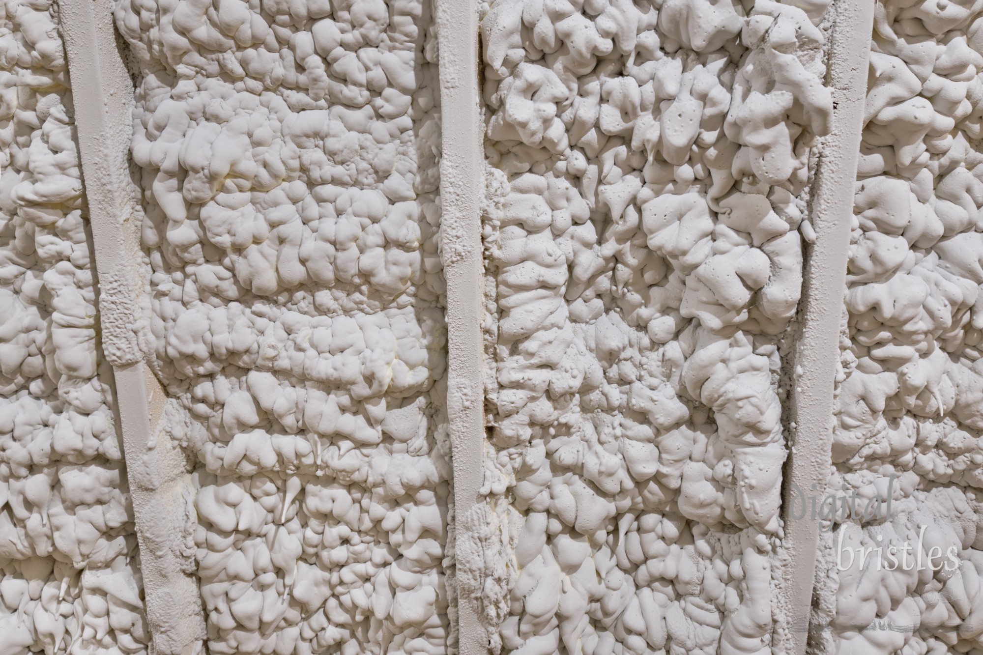 Closed cell foam insulation in a residential attic; detail view