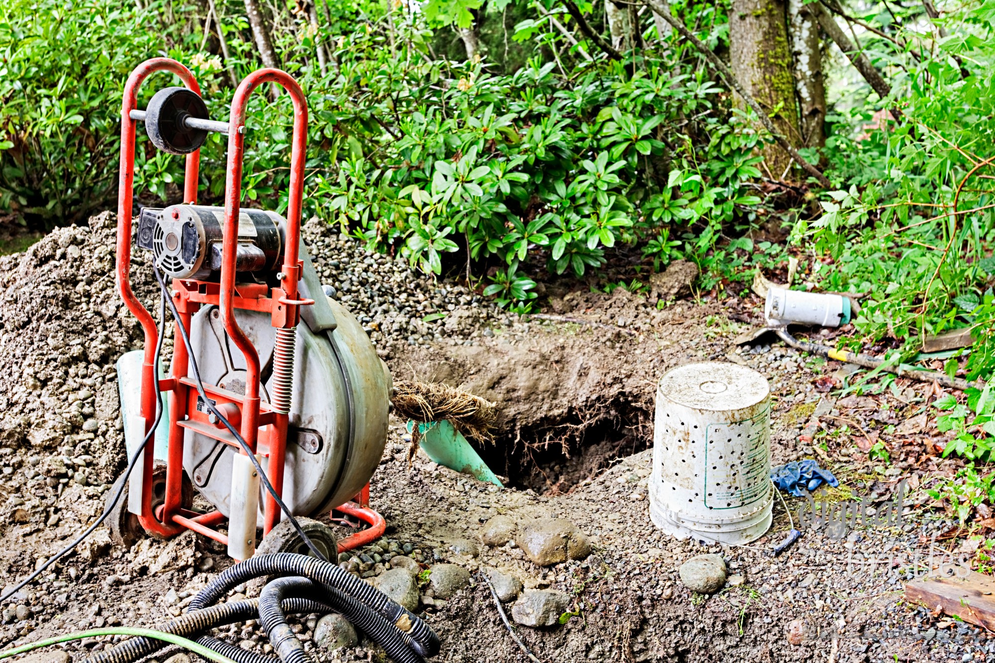 Removing tree roots from groundwater drainage pipe in a back yard