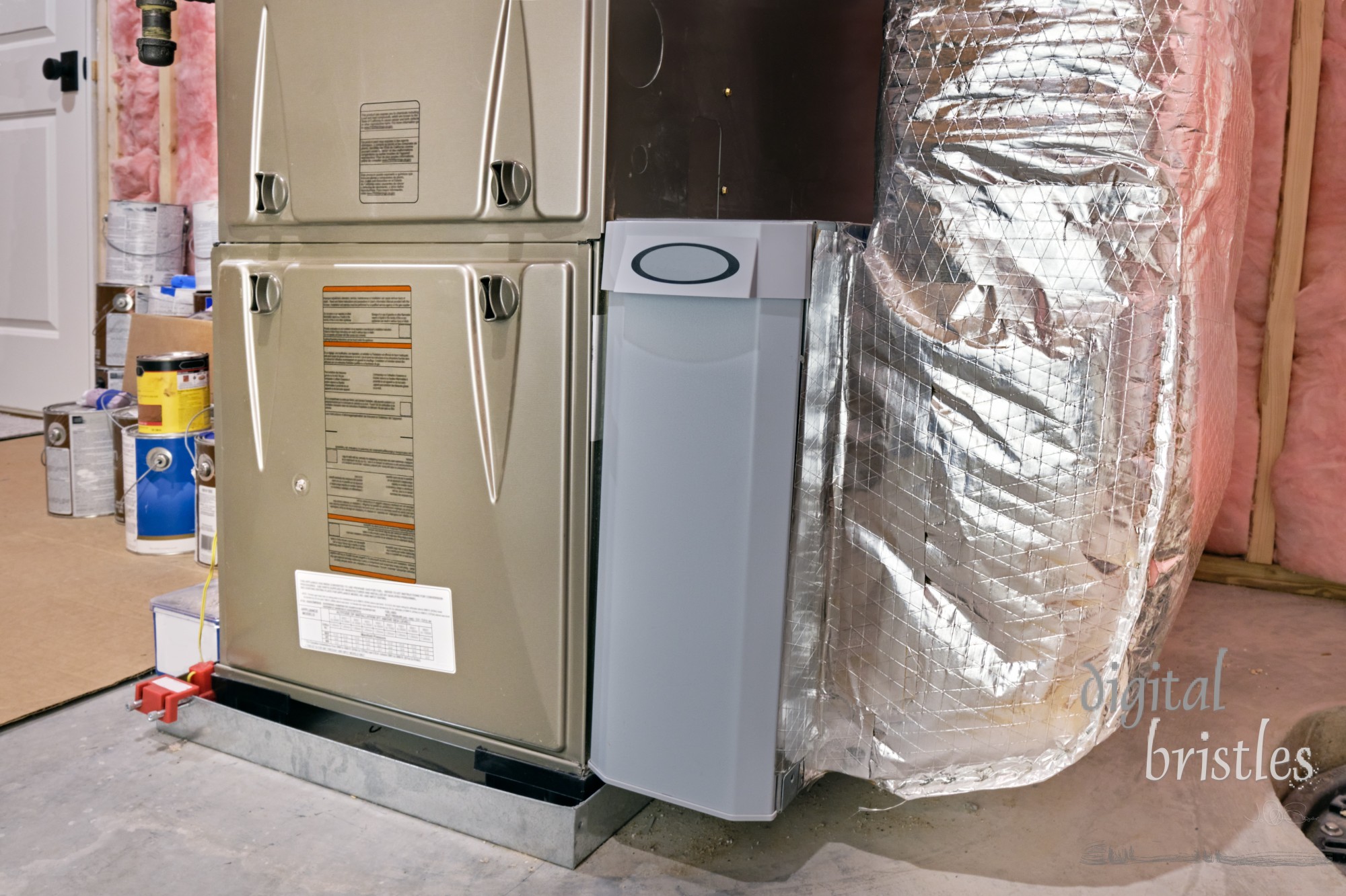 Air filter container between high efficiency furnace and ductwork in a basement utility room