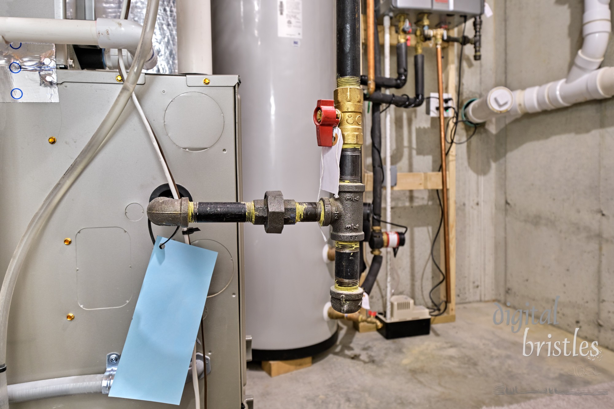 Furnace gas line and shutoff valve in concrete basement mechanical room