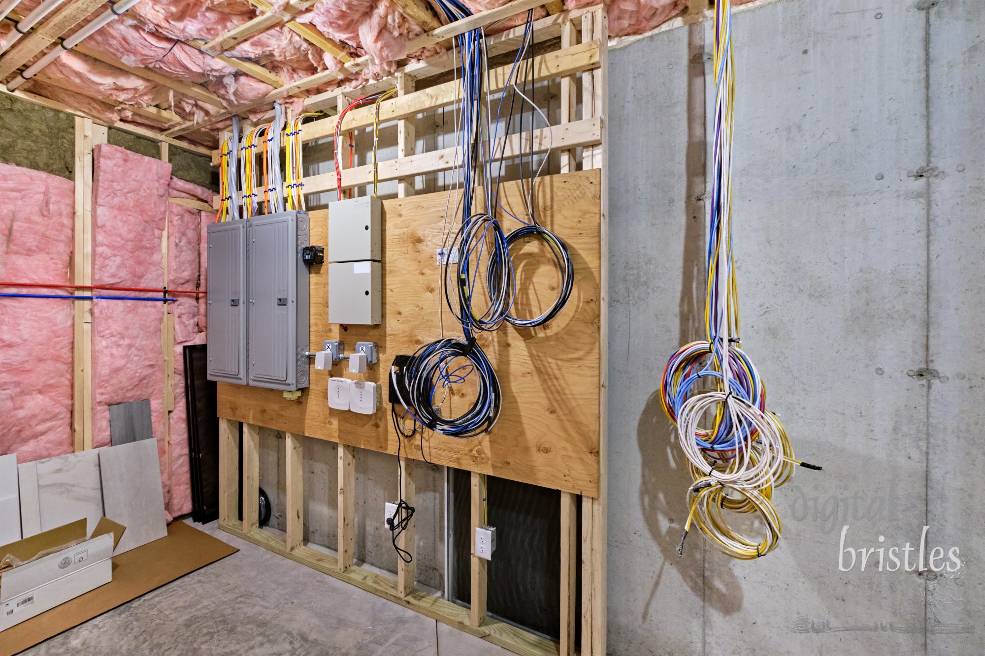 Basement mechanical room with electrical, plumbing and network systems