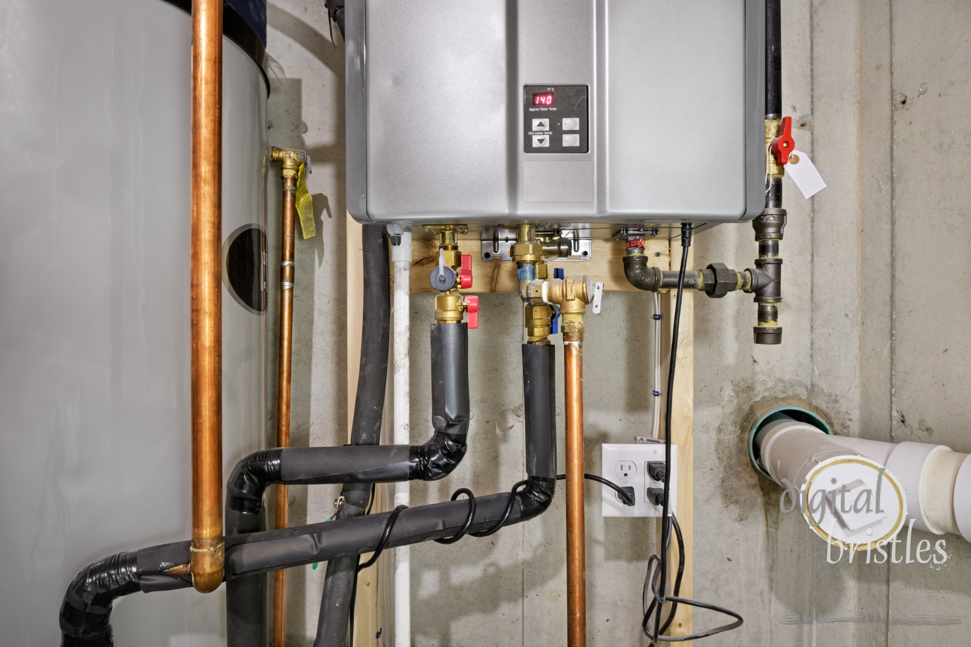 Tankless hot water heater connected to a recirculation system and storage tank