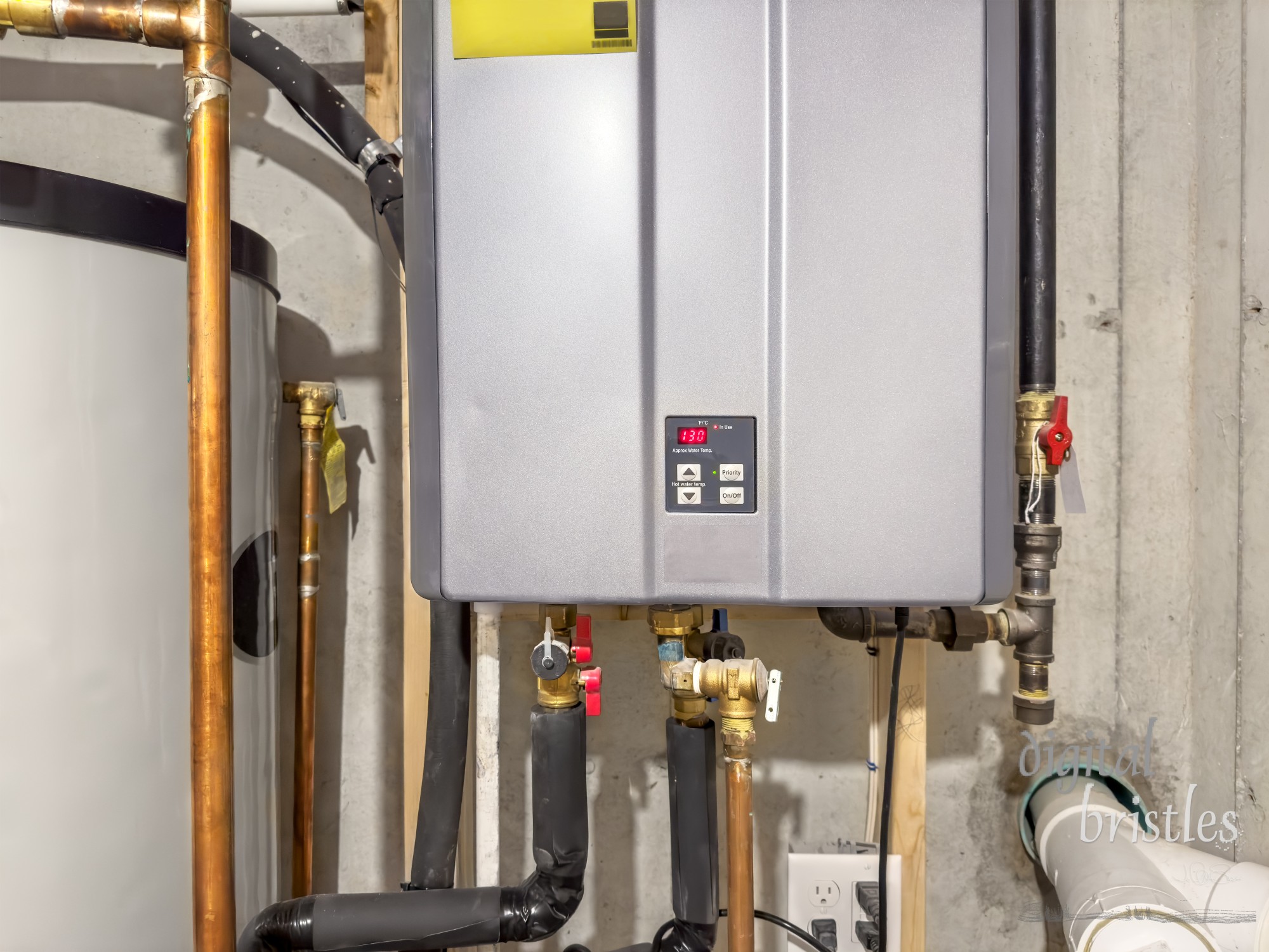 Tankless hot water heater, set to 130° F,  connected to a recirculation system and storage tank