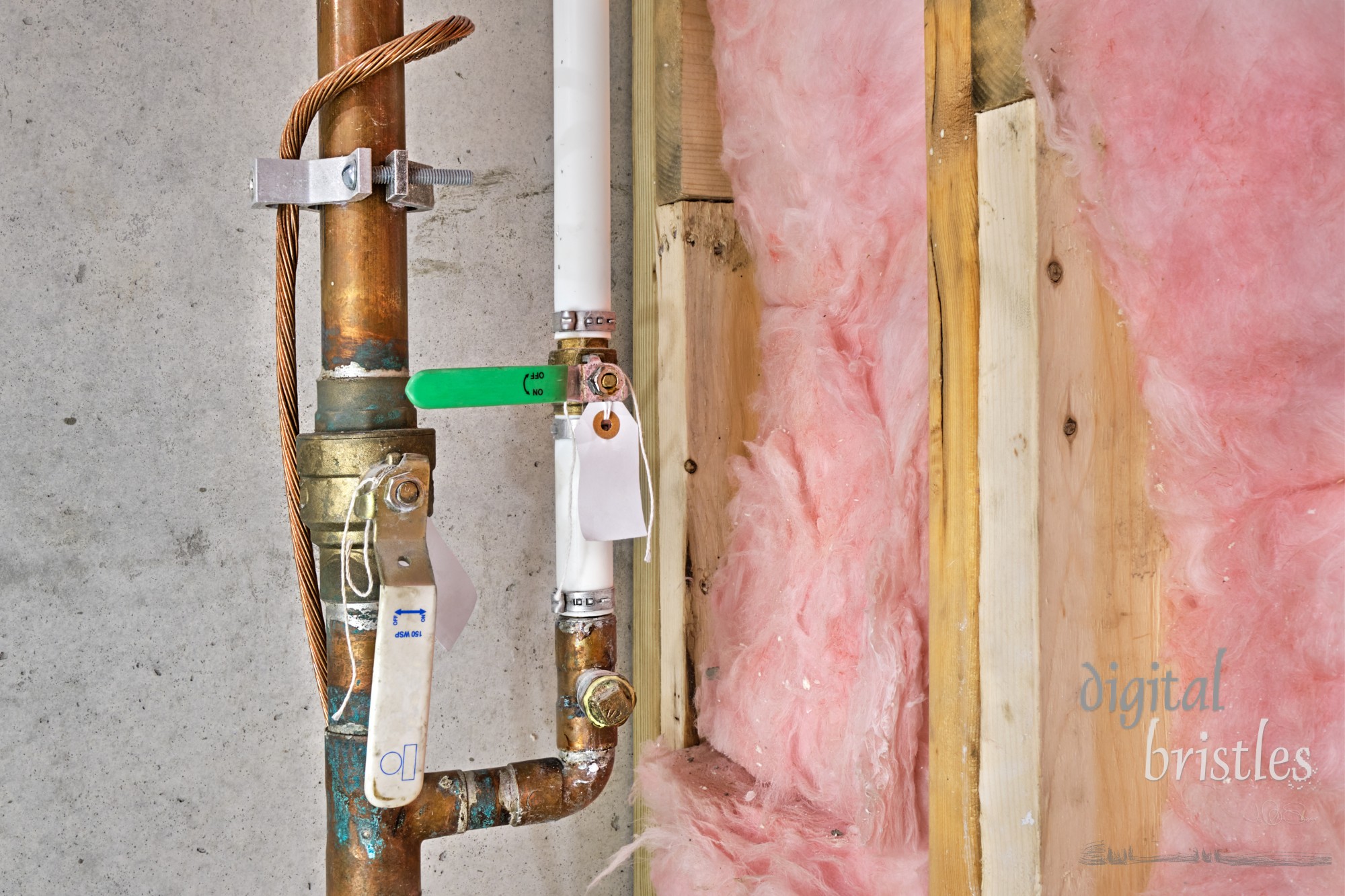 Copper water pipes with shut-off valves, twisted copper wire and grounding clamp