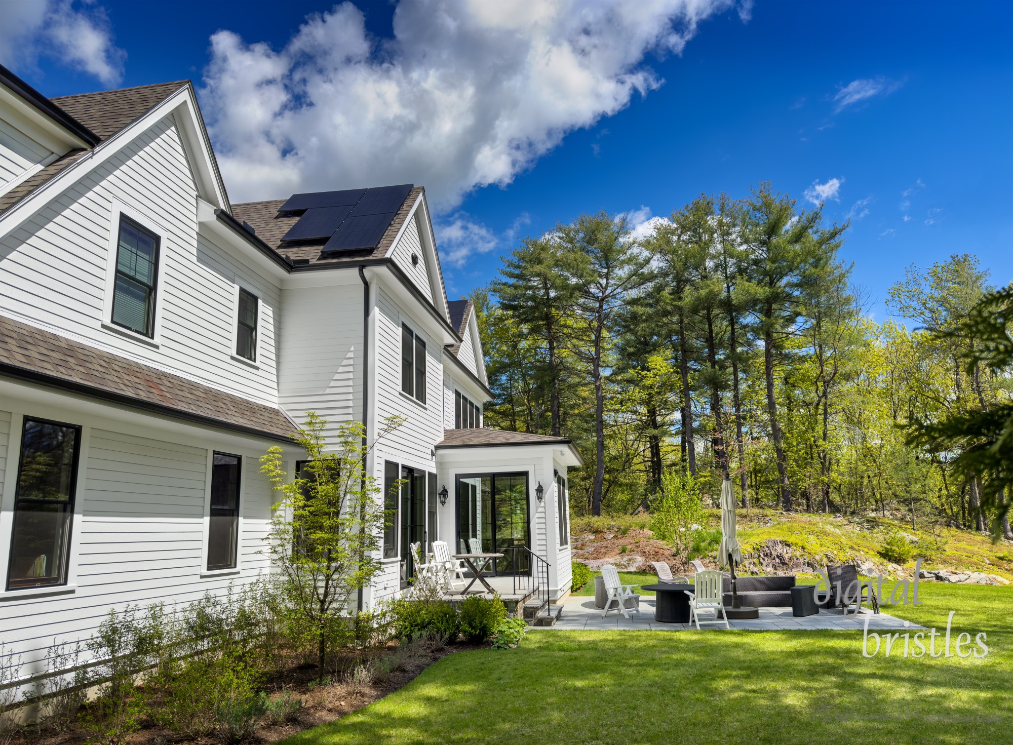 Bright Spring sunshine brings plenty of green, renewable energy  to a suburban home via rooftop solar panels