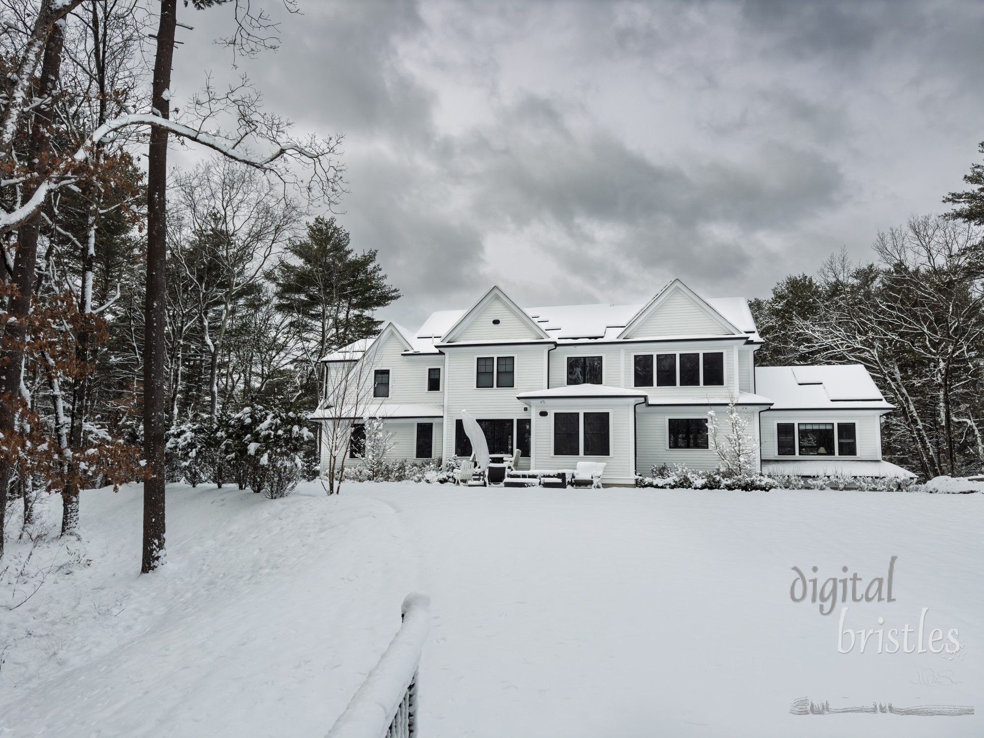 Suburban home's rooftop solar panels completely covered by a winter snowstorm