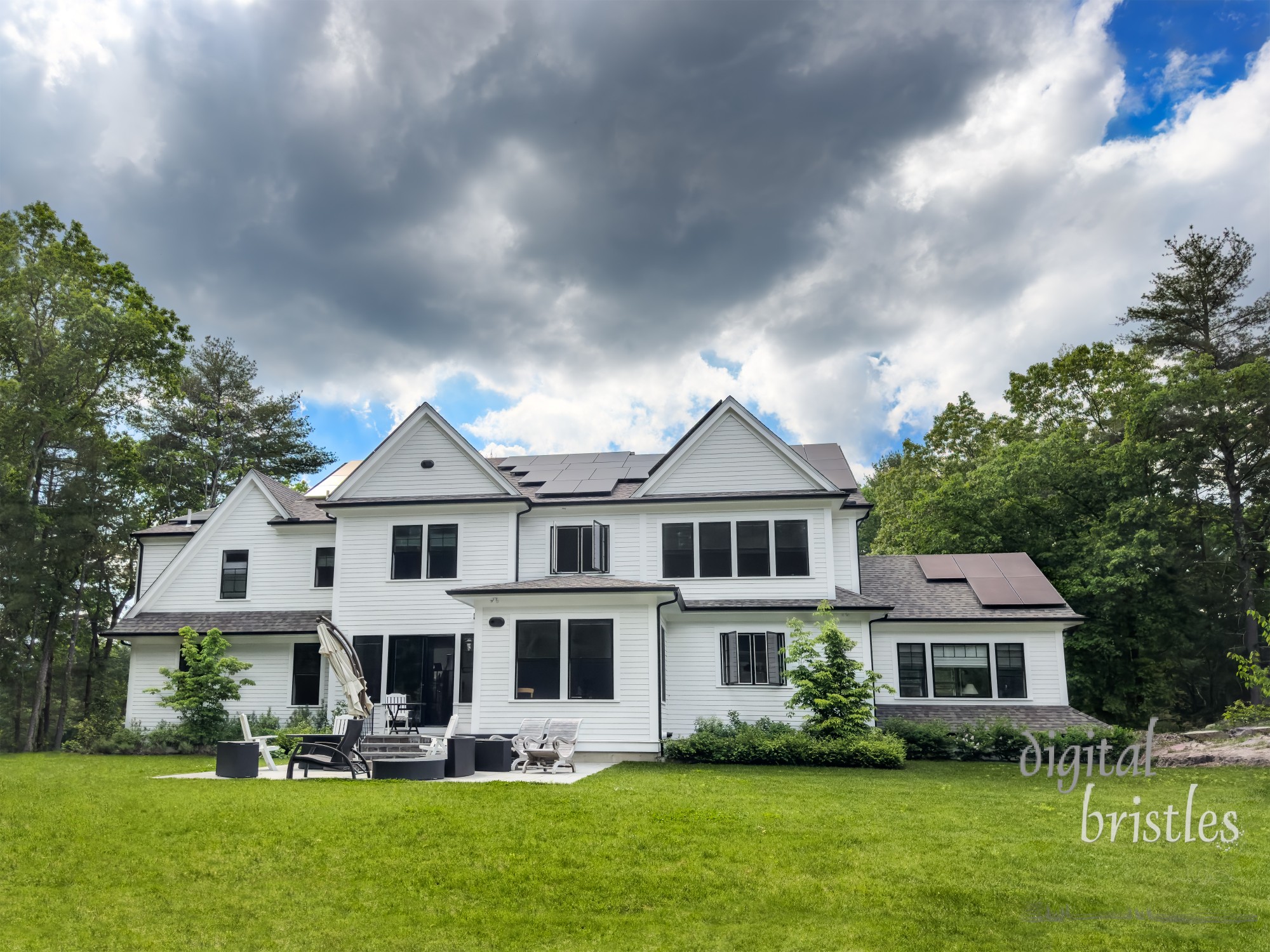 Suburban home with rooftop solar panels sees slow solar production on a cloudy late Spring afternoon