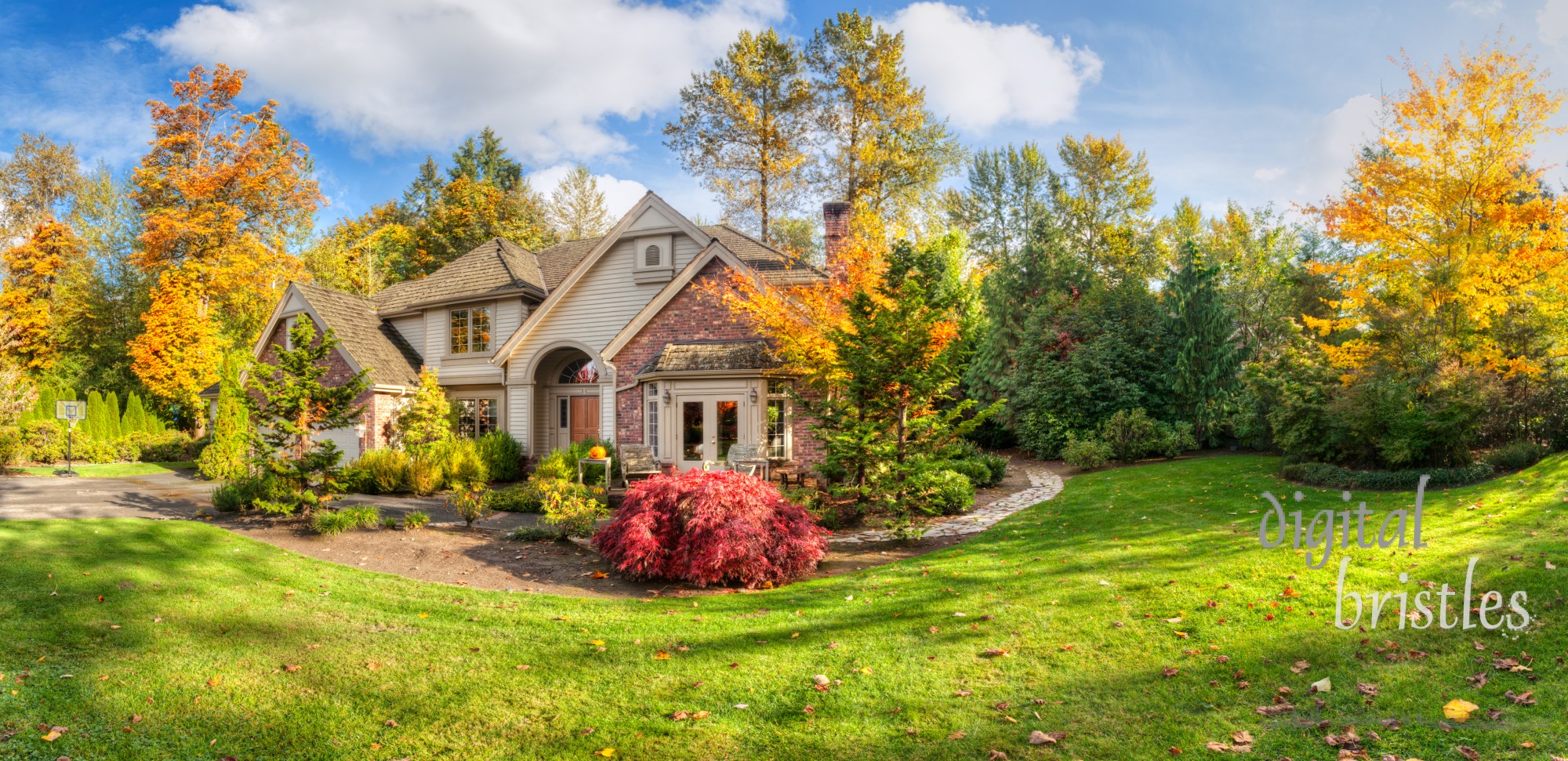 Panorama of suburban home on a sunny autumn afternoon