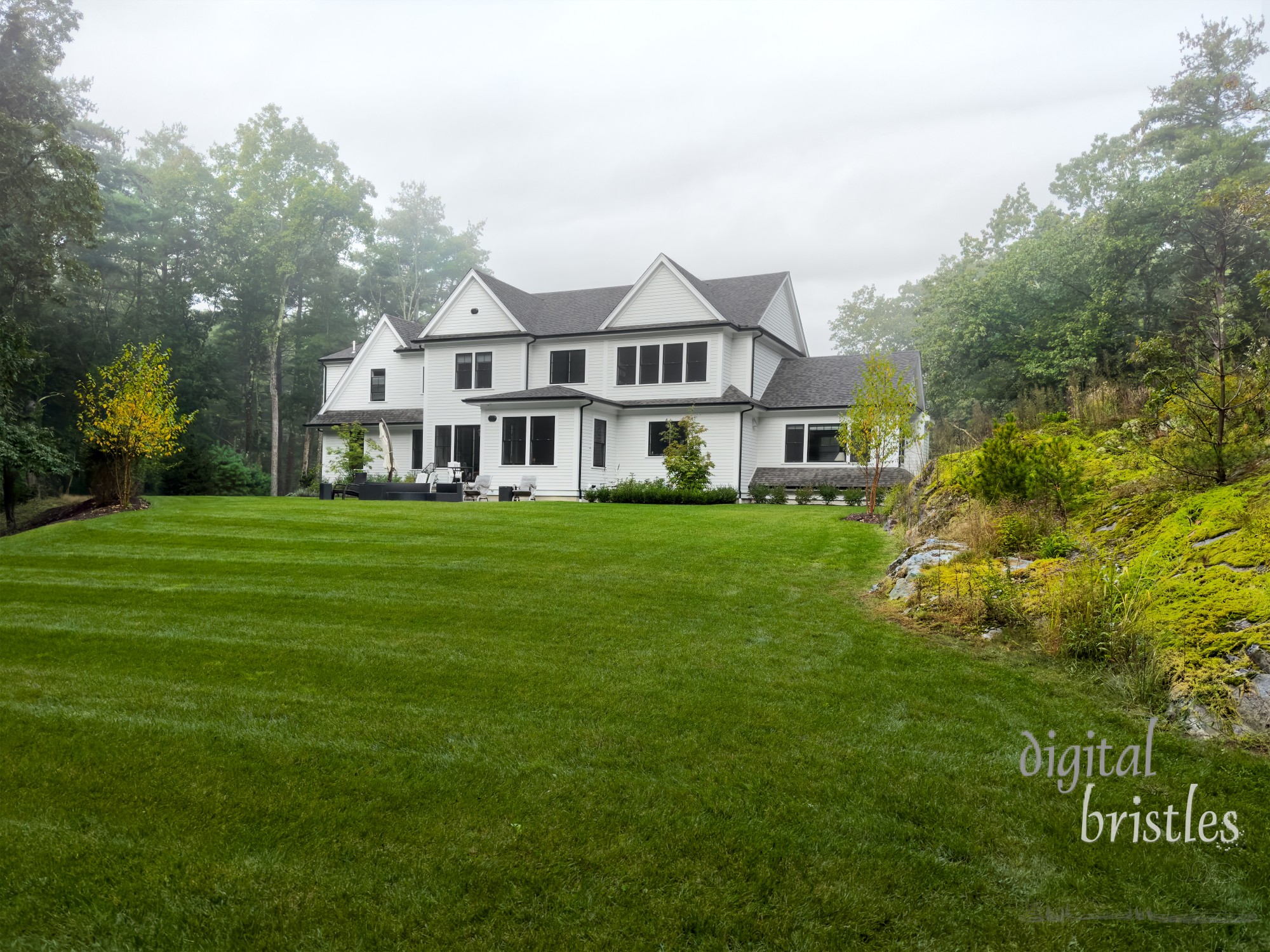 Cold autumn air brings mist to a suburban New England house