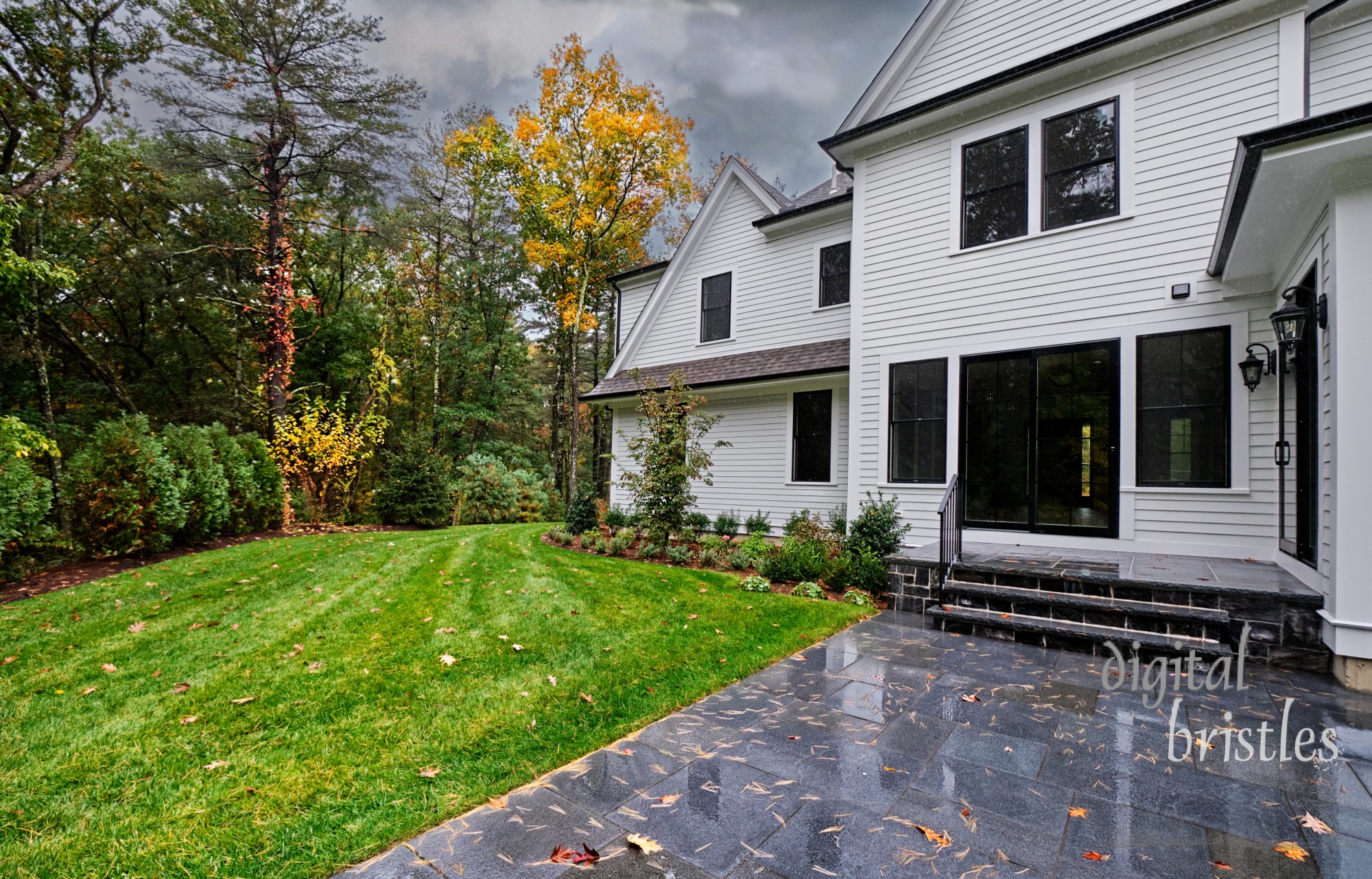 Autumn colors fade as a rainy breezy day soaks the back patio and garden