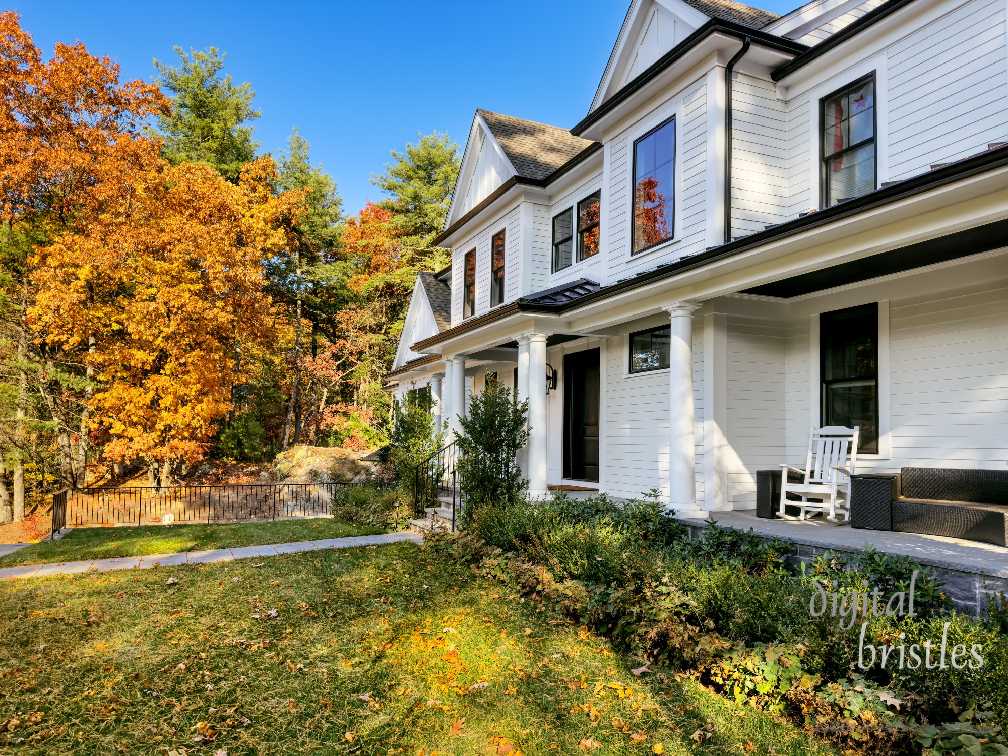 Autumn colors plus leaves and pine needles on the lawn signal a fall afternoon in New England