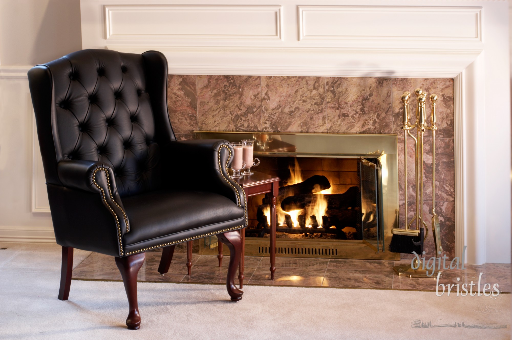 Black leather chair by the fire