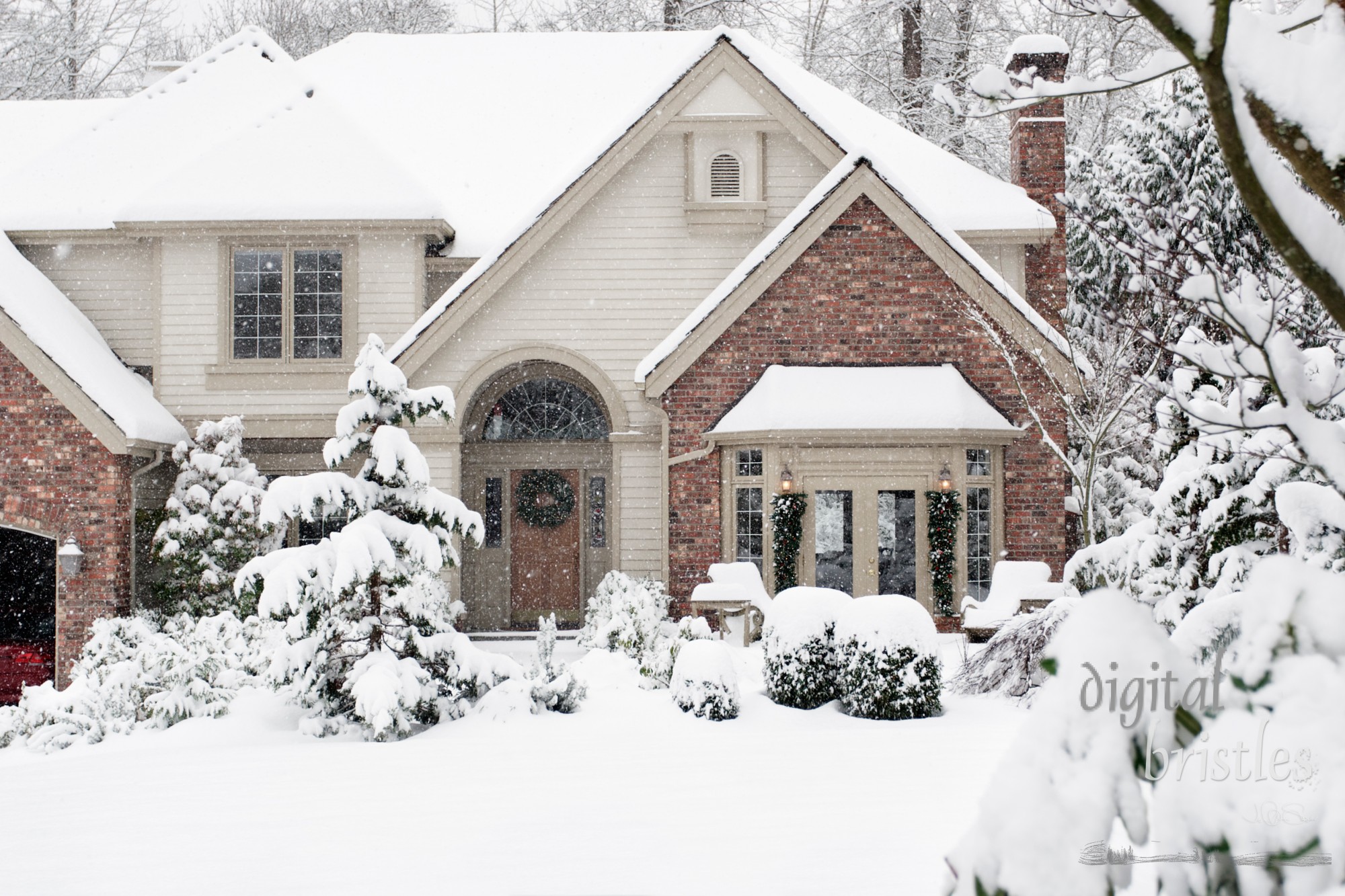 Front of suburban home in heavy snowfall