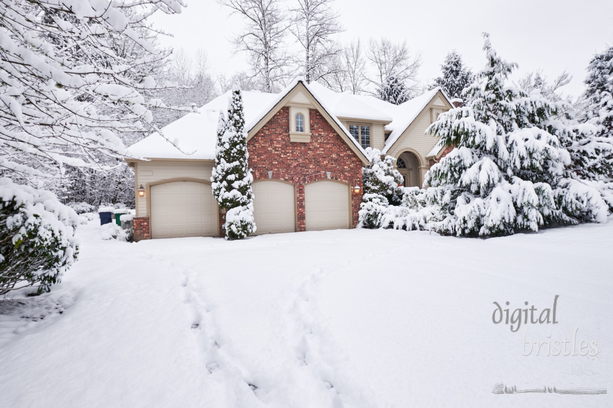 Suburban home blanketed in snow with footprints leading to the front door and around the back