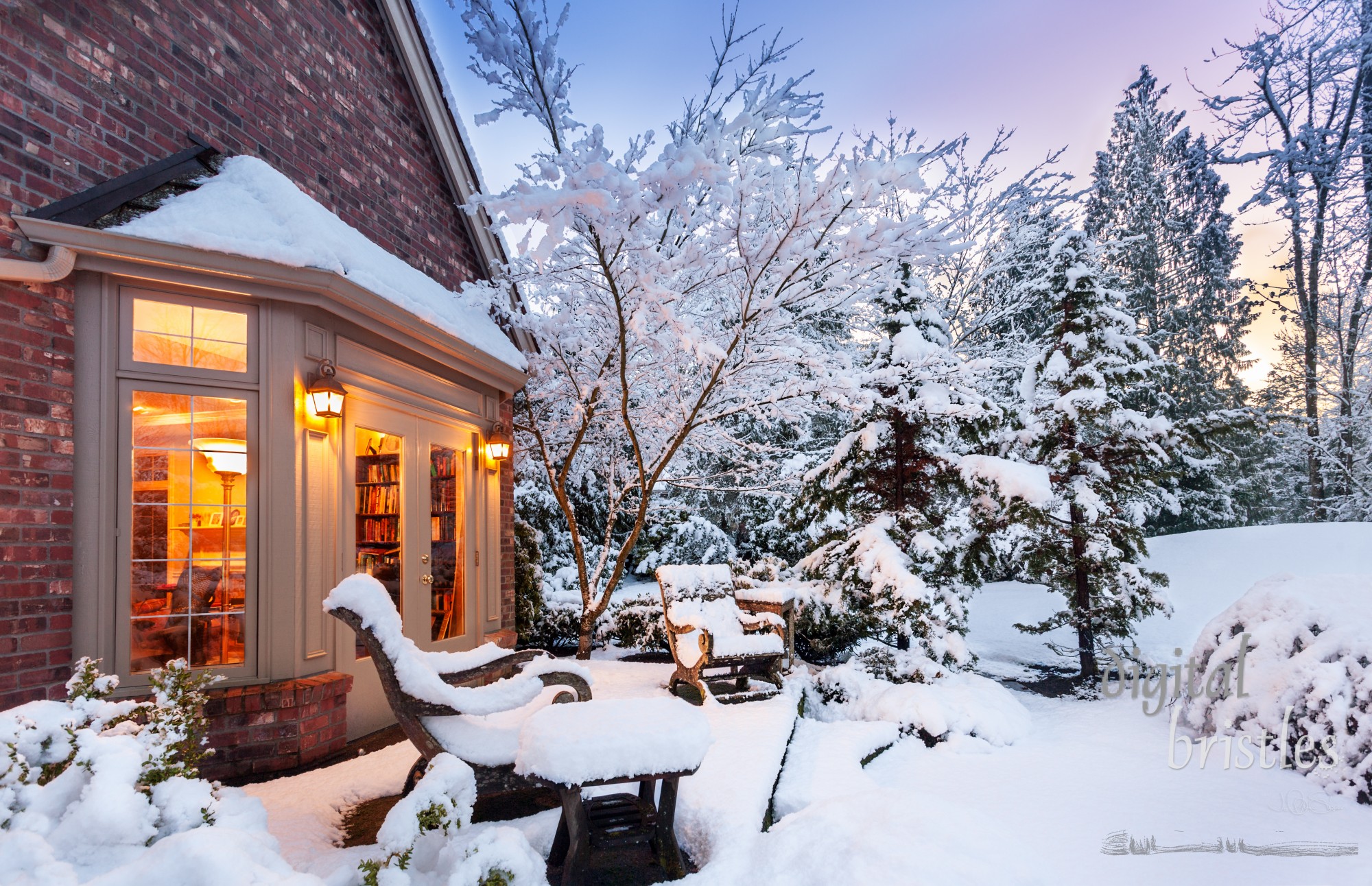 Home blanketed in snow as sun goes down on a winter evening