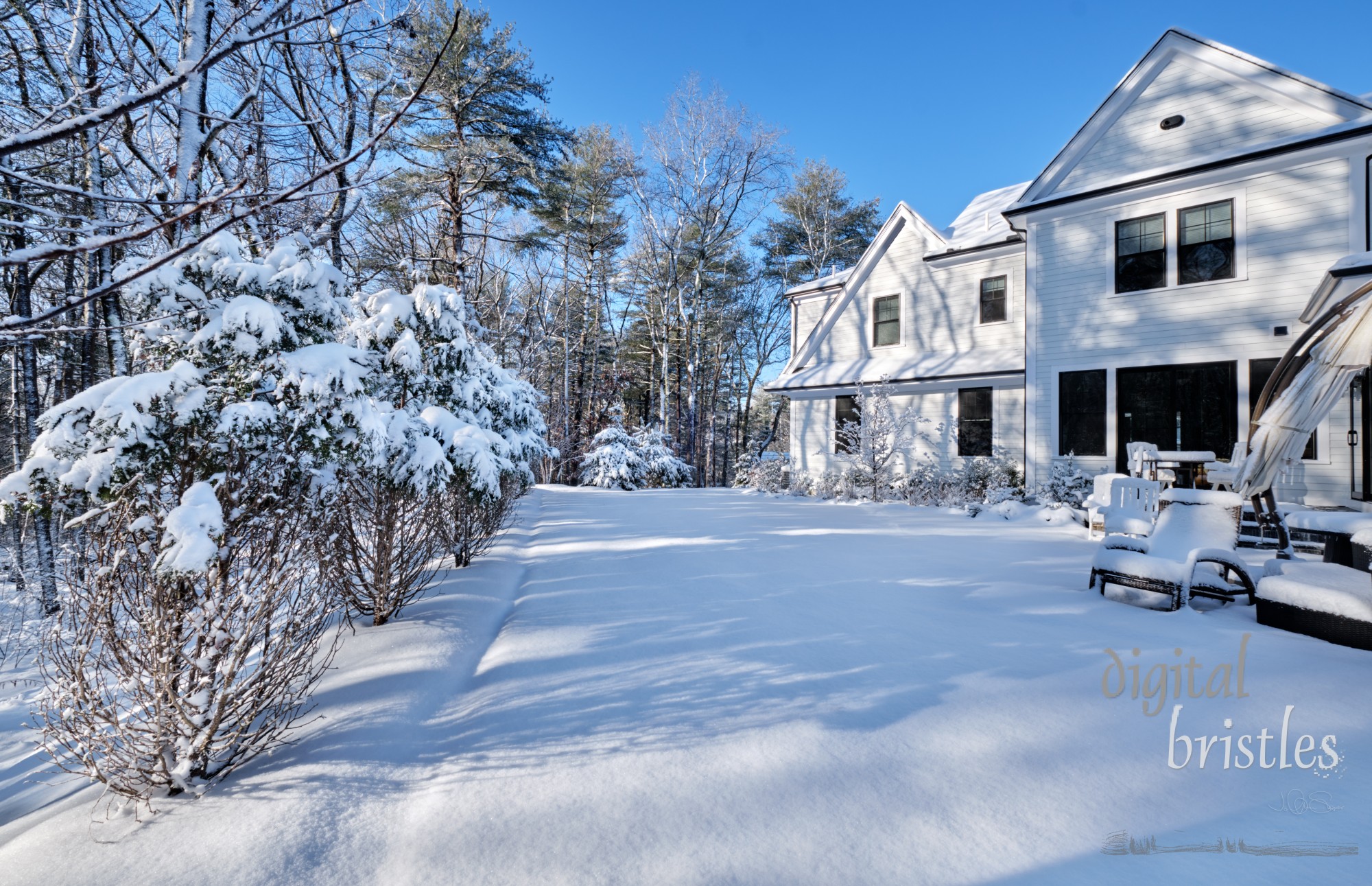 Back garden of a suburban home the morning after a Winter snowstorm