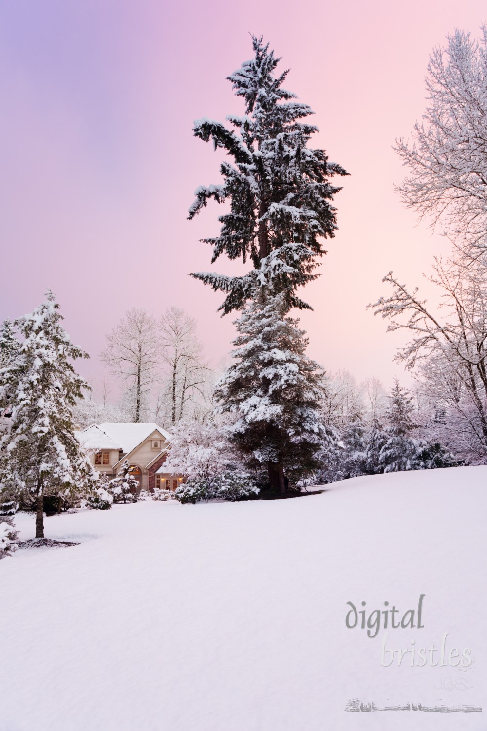 Colorful sky over suburban home at the end of a snowy day