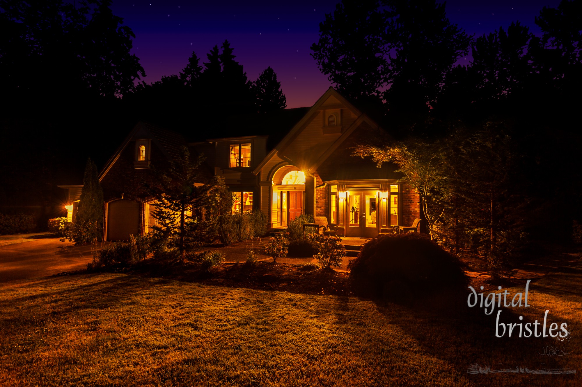 Suburban home at night with windows lit up and light spilling out onto the front lawn