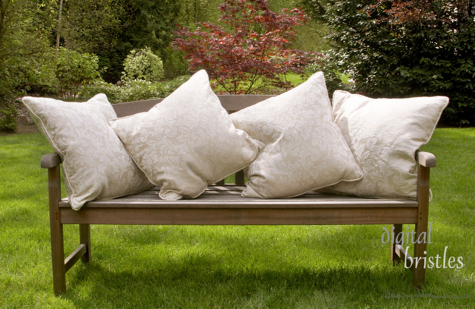 Wood garden bench with cushions