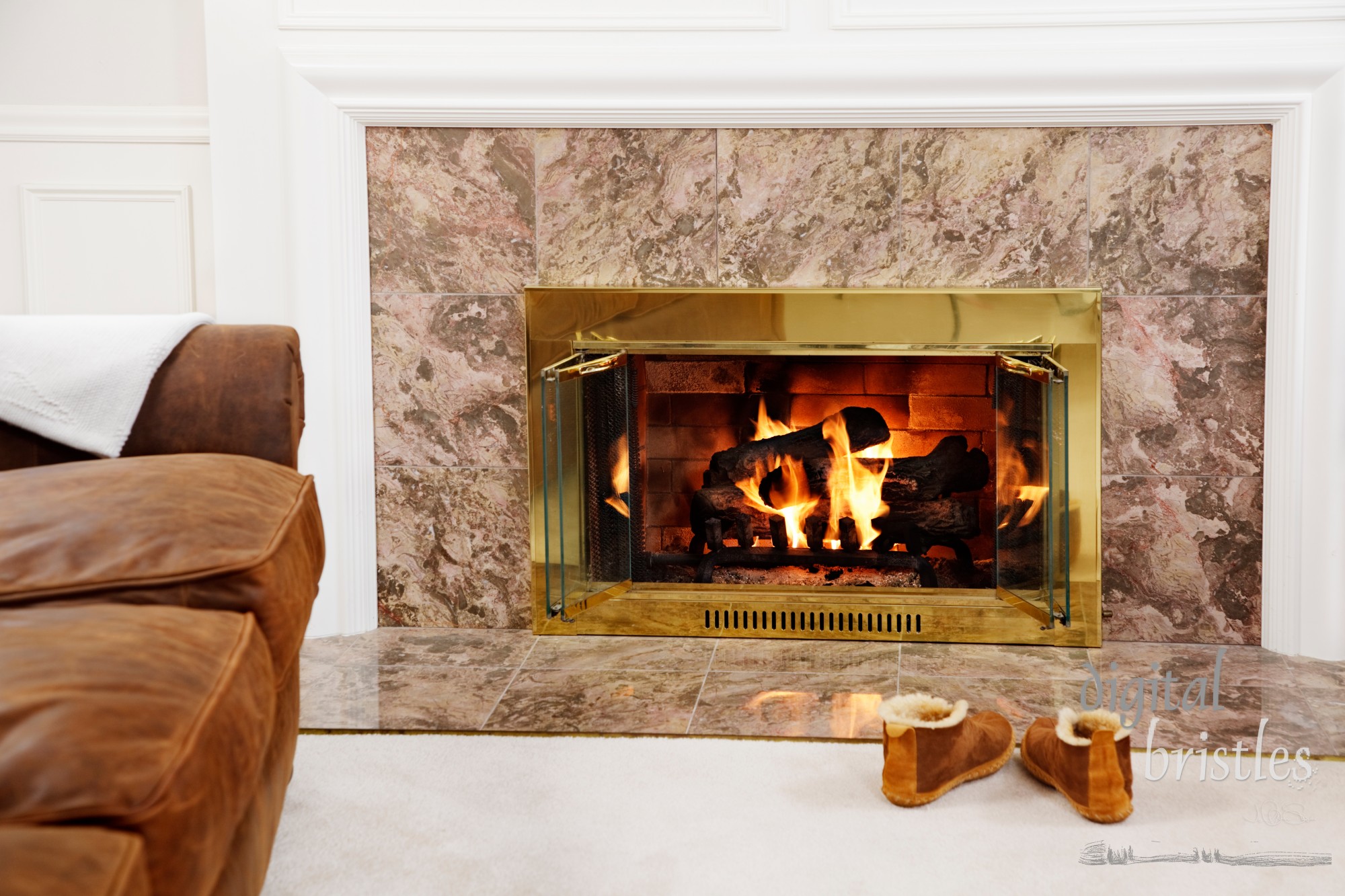 Living room with a warm fire, throw blanket and slippers