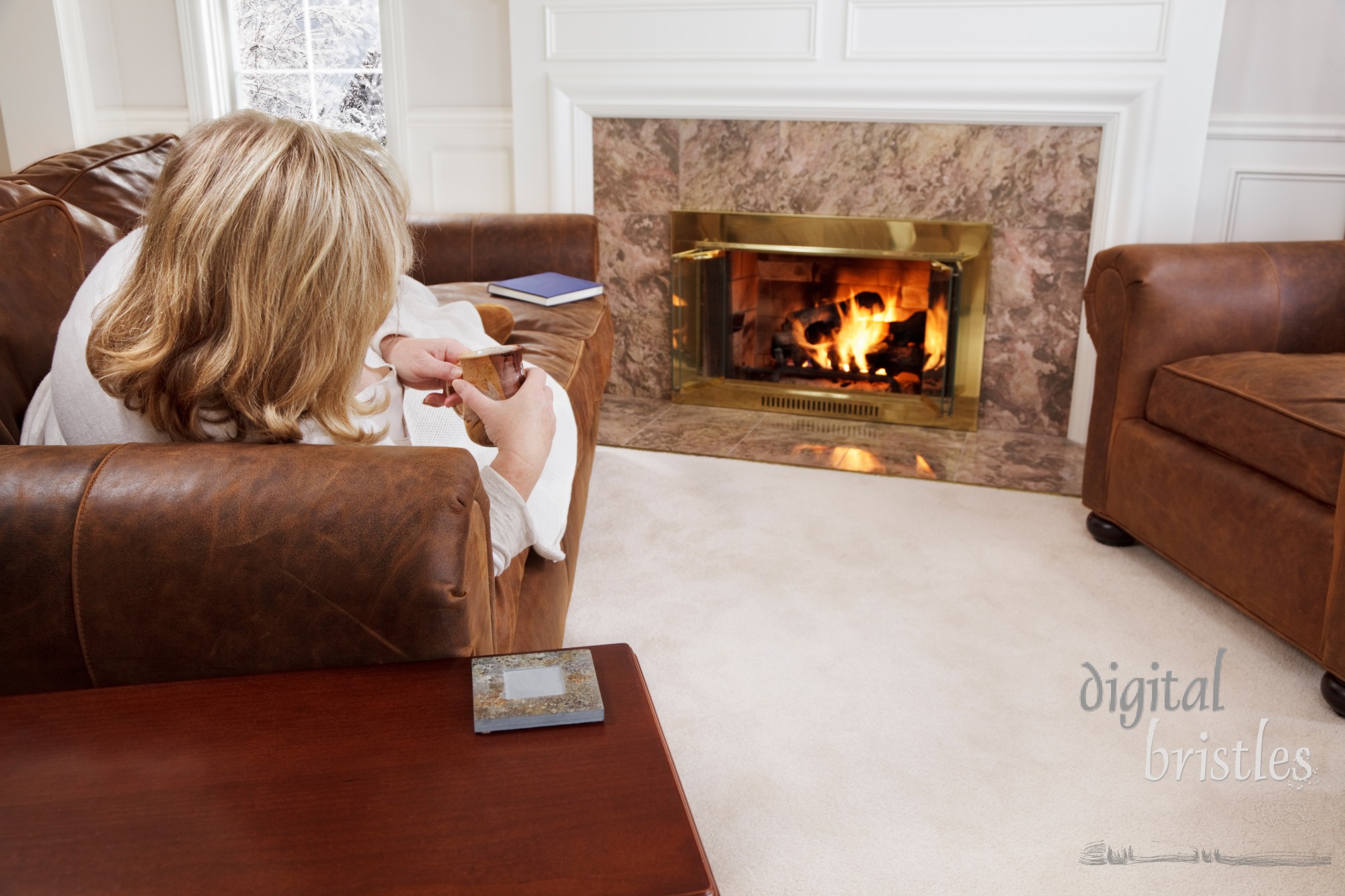 Woman relaxing by a cozy fire