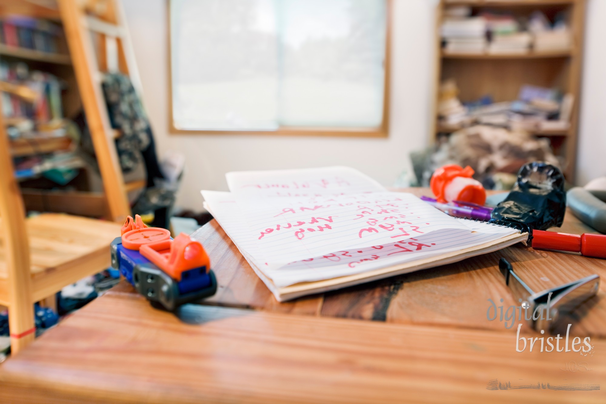 Teenage boy's messy room. Tilt shift lens, with focus on notebook