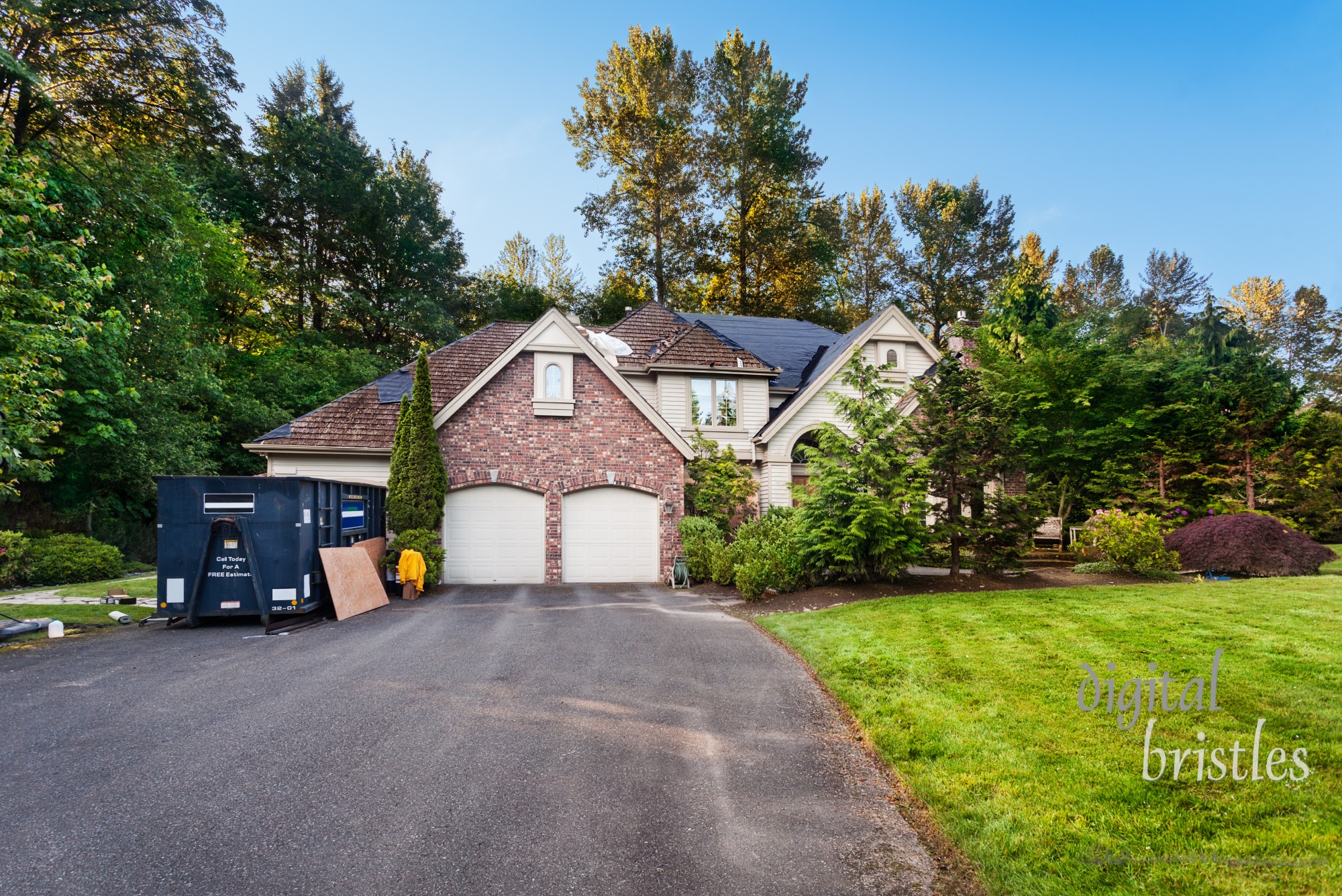 Re-roofing suburban house: old cedar shakes partially removed