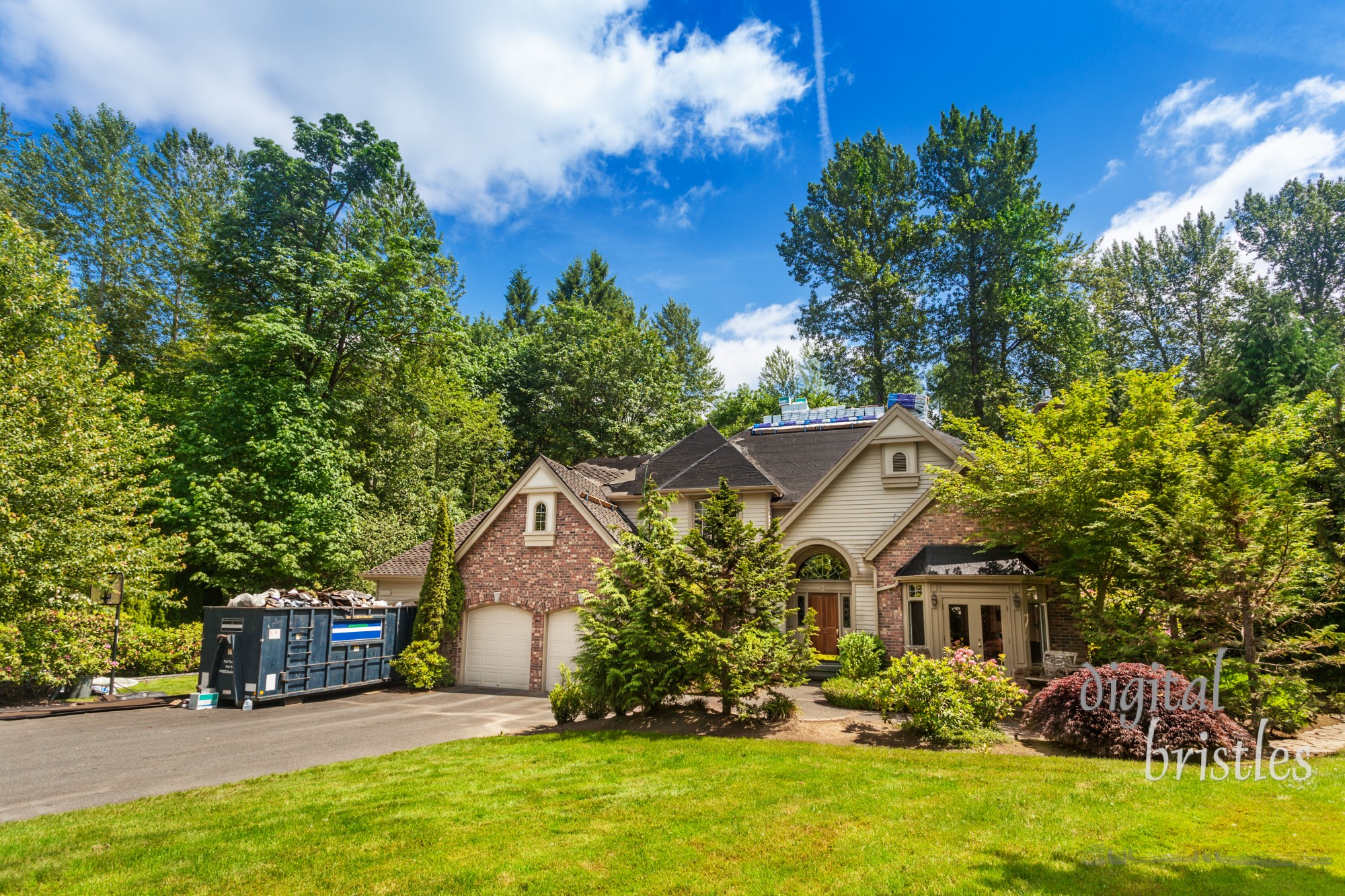 New roofing partially complete on suburban home