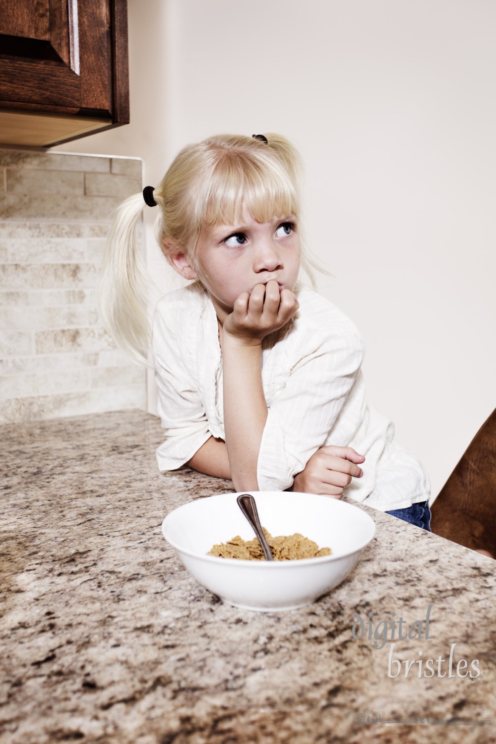 Young girl looks puzzled and glum