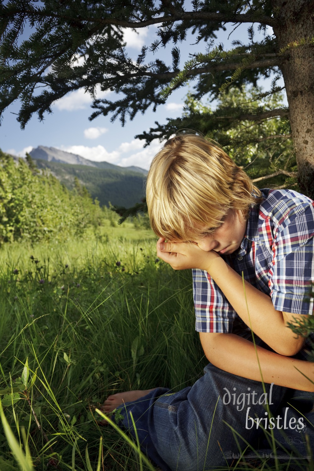 Young boy finds an isolated place to sit and cry