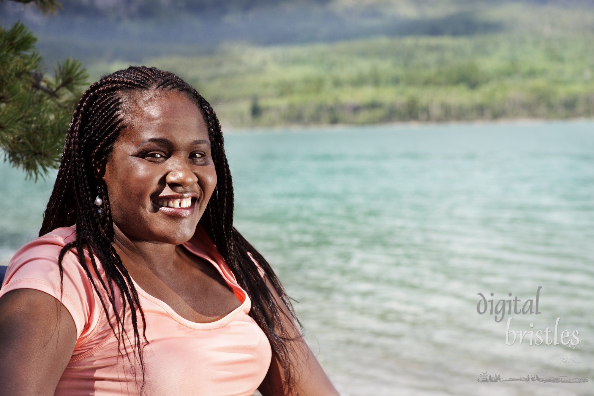 Young african american woman relaxes lakeside