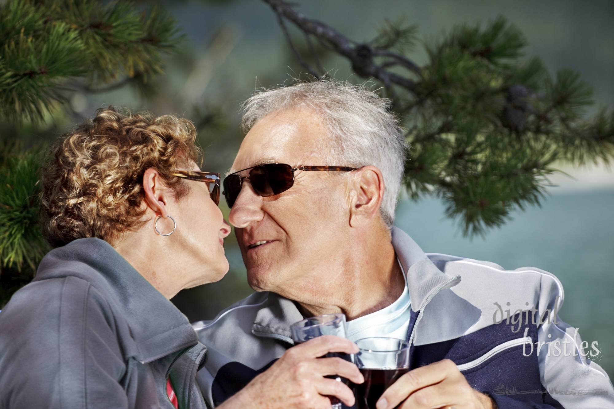 Senior couple enjoying a sunny afternoon, still very much in love