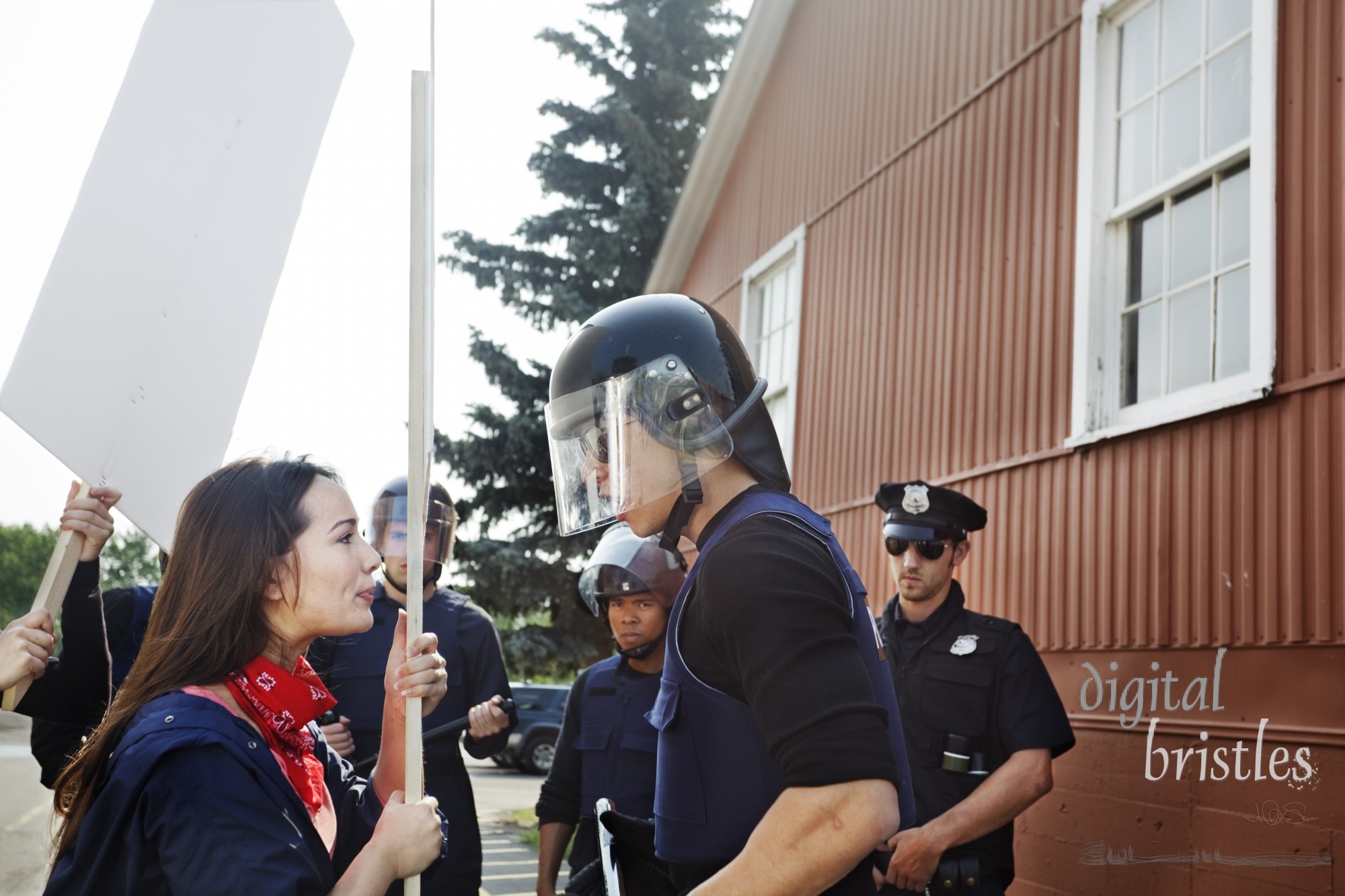 Protester trying to make her point as the officer yells at her