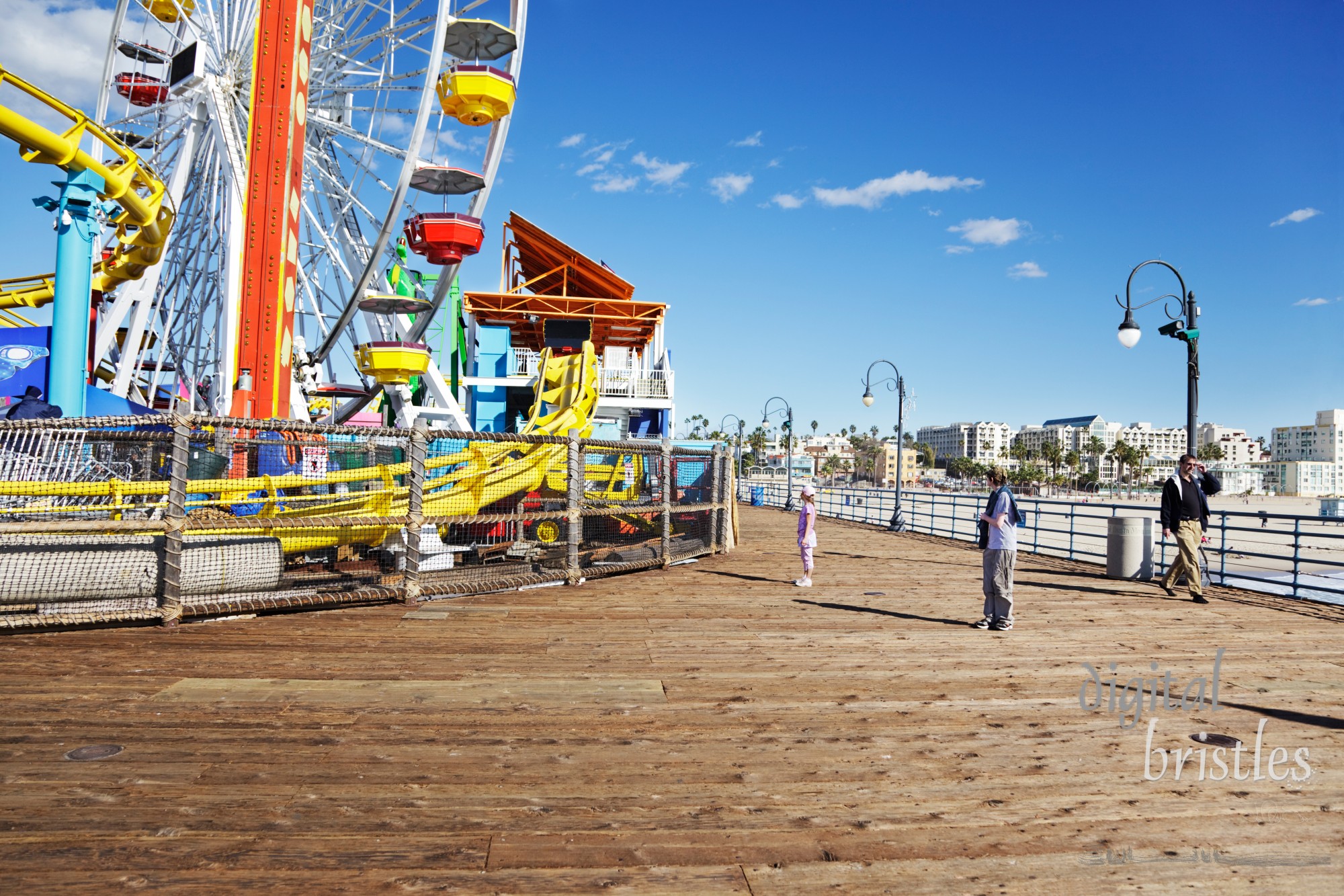 Kids try to decide about the rollercoaster and ferris wheel - too big for her, too baby-ish for him