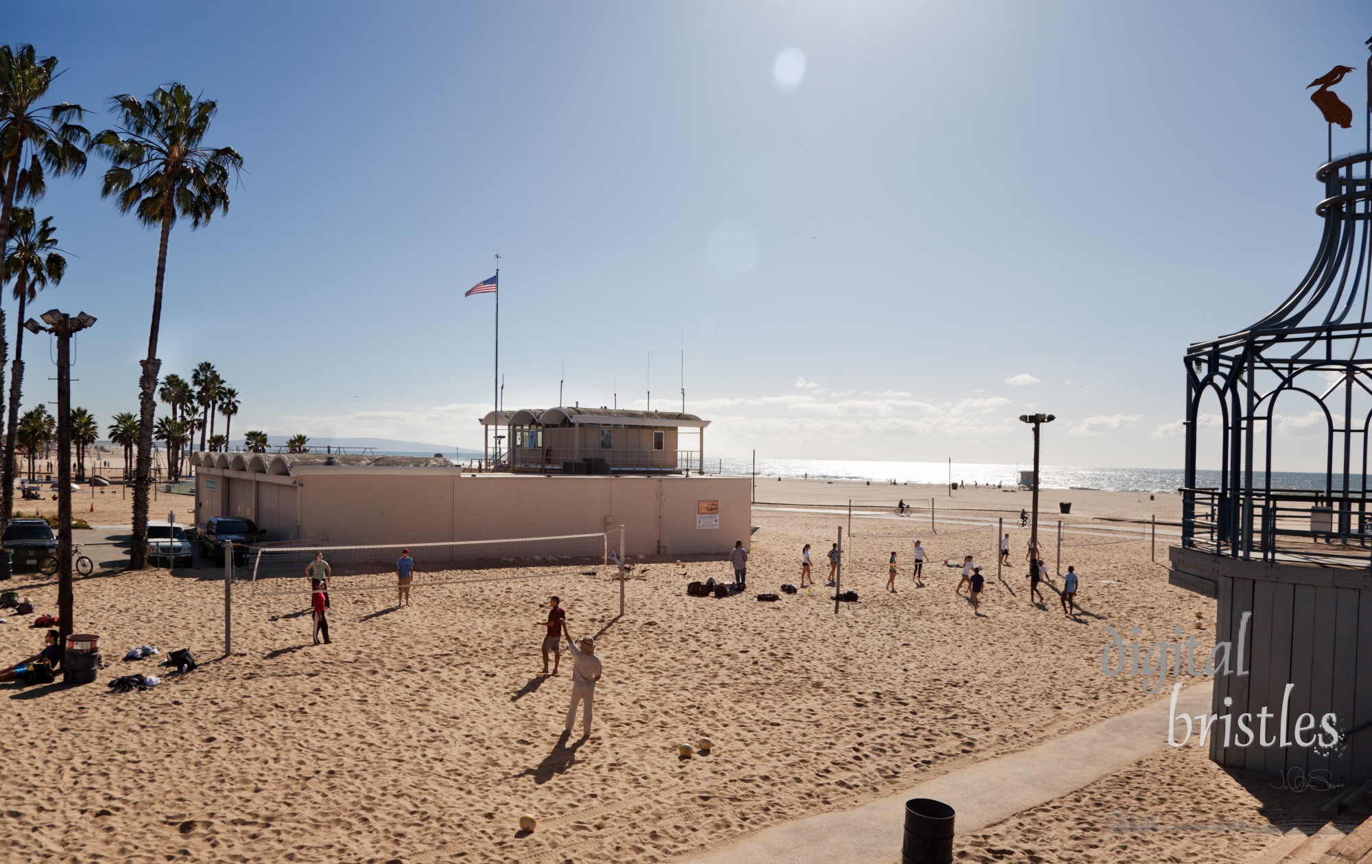 Volleyball games played on the beach next to the Santa Monica Pier. Three days before Christmas, but the relatively warm weather brought many to ride bikes, jog or play volleyball on the beach.