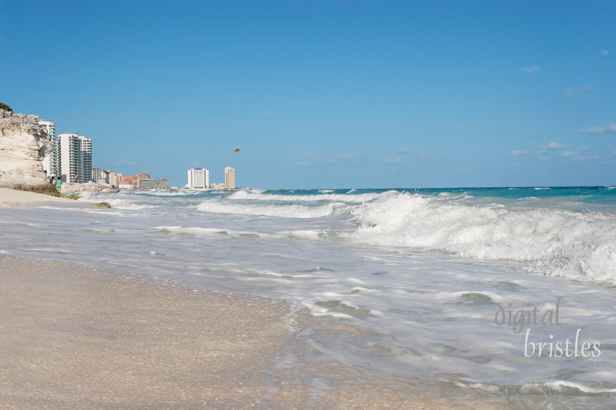 Waves breaking over the white sand, Cancun, Mexico