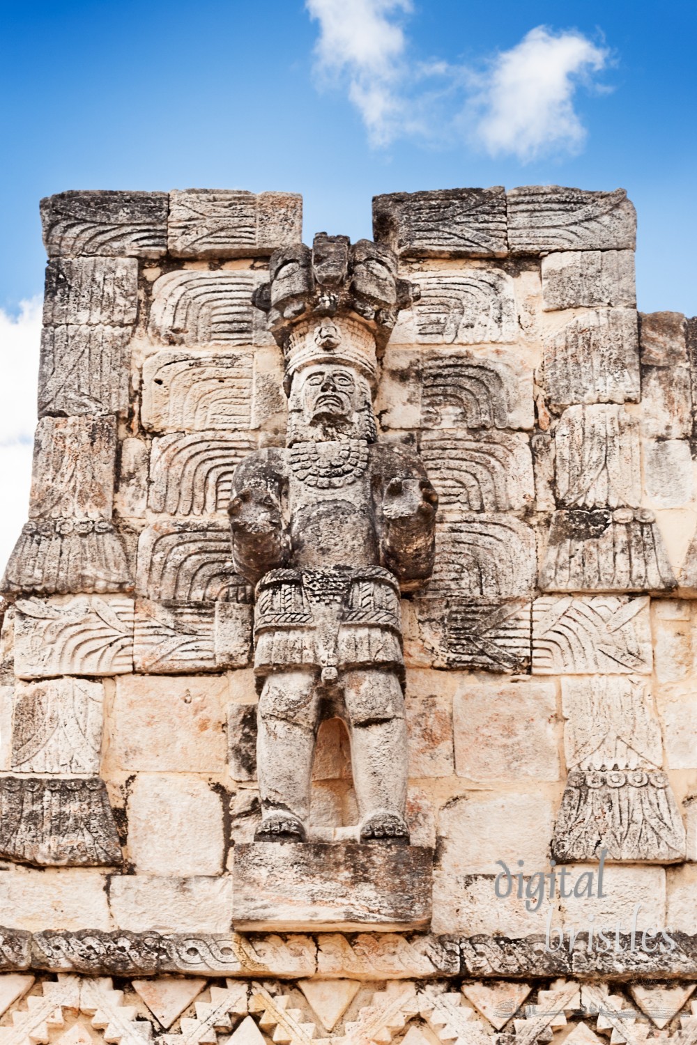 Partially restored statue of a Mayan warrior at Codz Poop, Kabah, Mexico